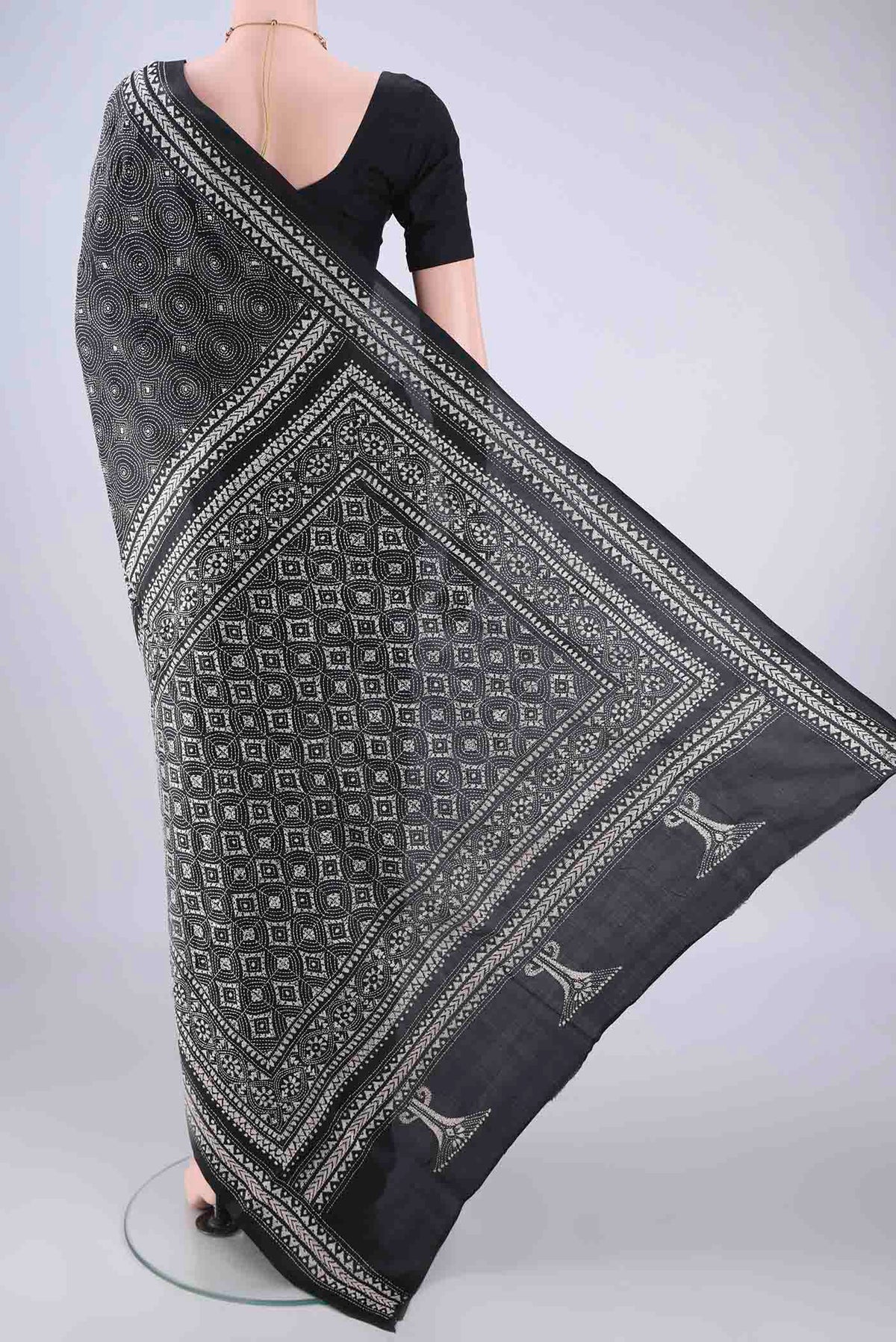 Flat view of Black Kantha Silk Saree with Kantha Work on the body and Thread Border. 