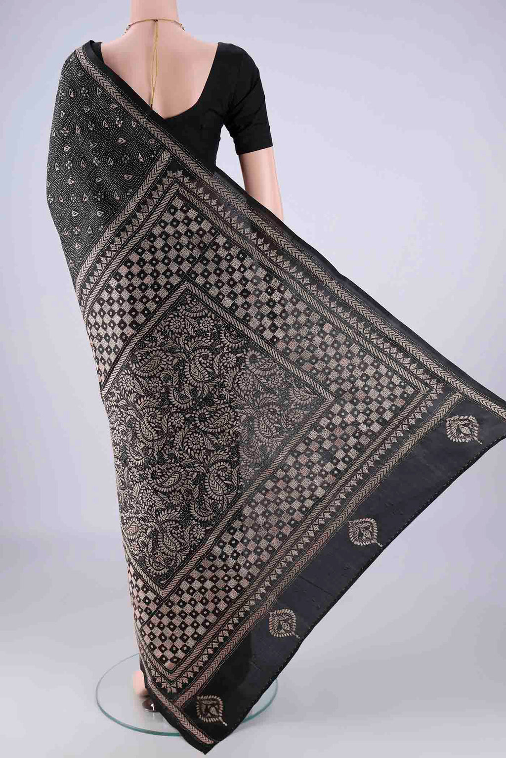 Flat view of Black Kantha Silk Saree with Kantha Work on the body and Thread Border. 