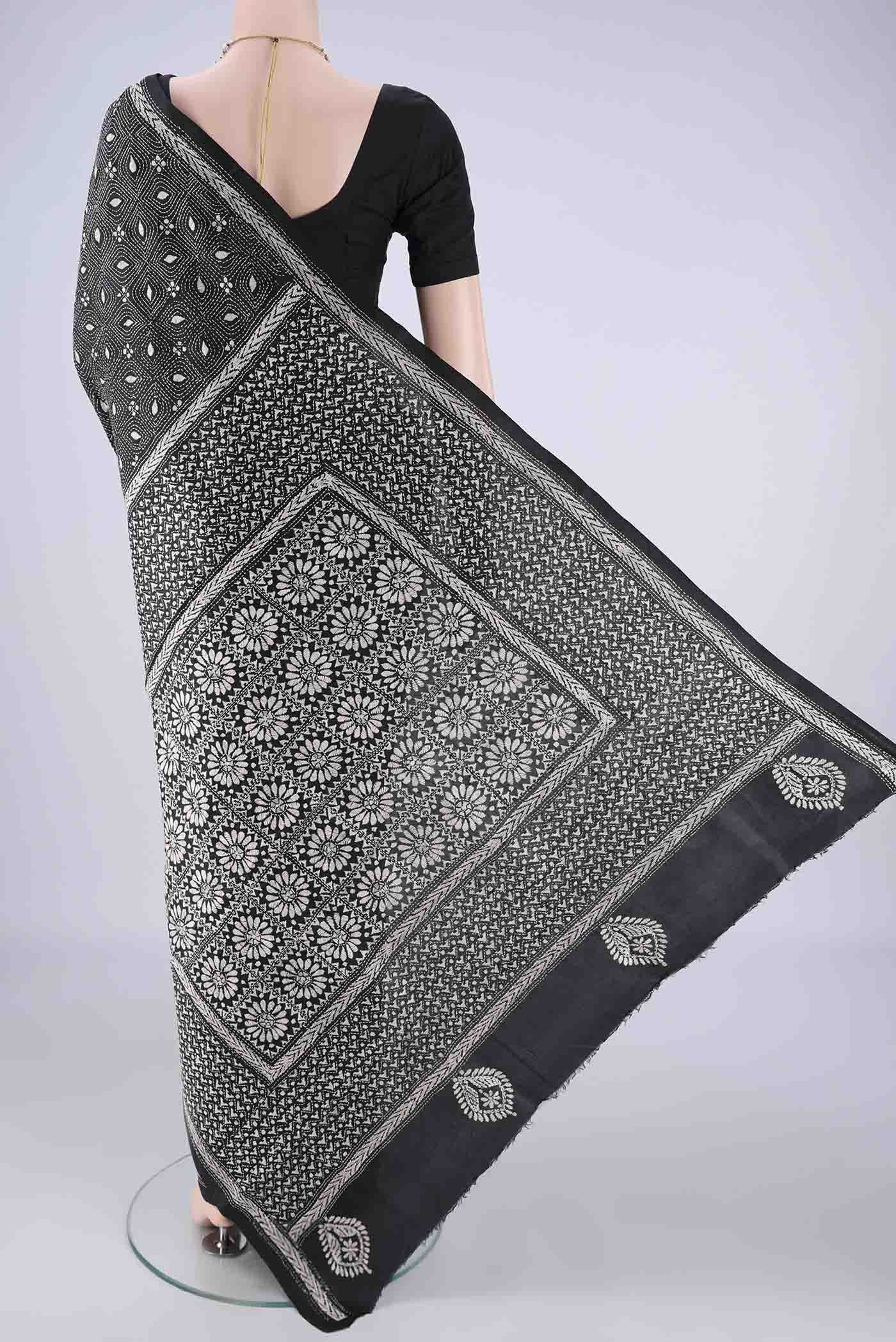 Flat view of Black Kantha Silk Saree with Kantha Work on the body and Thread Border. 