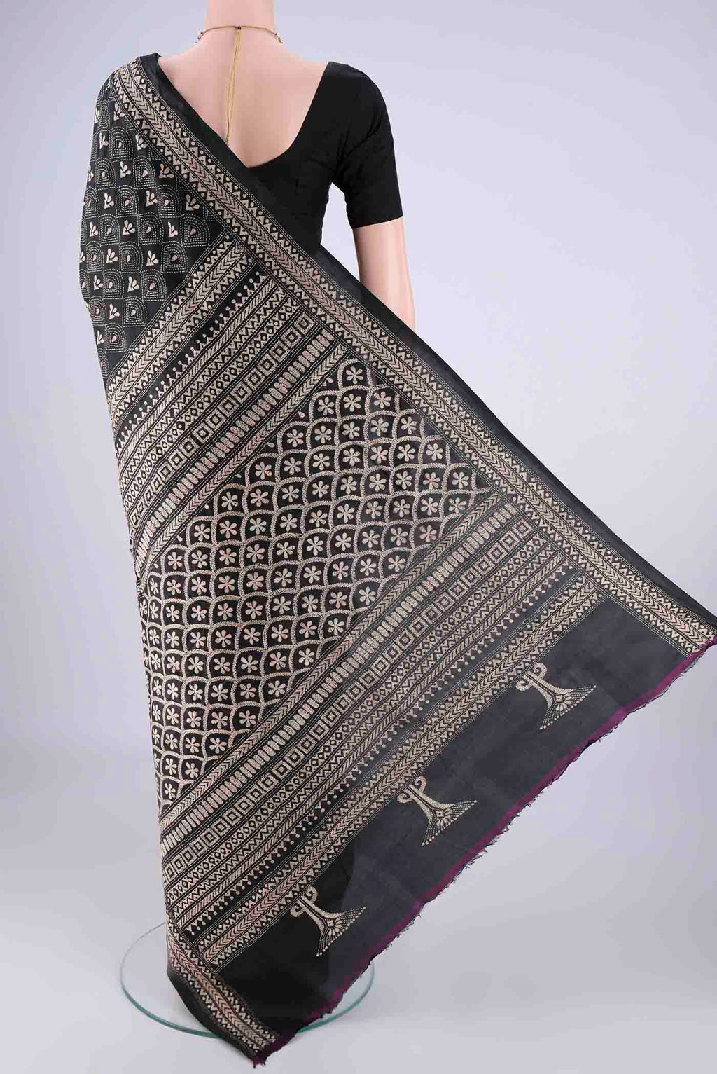 Flat view of Black Kantha Silk Saree with Kantha Work on the body and Thread Border. 