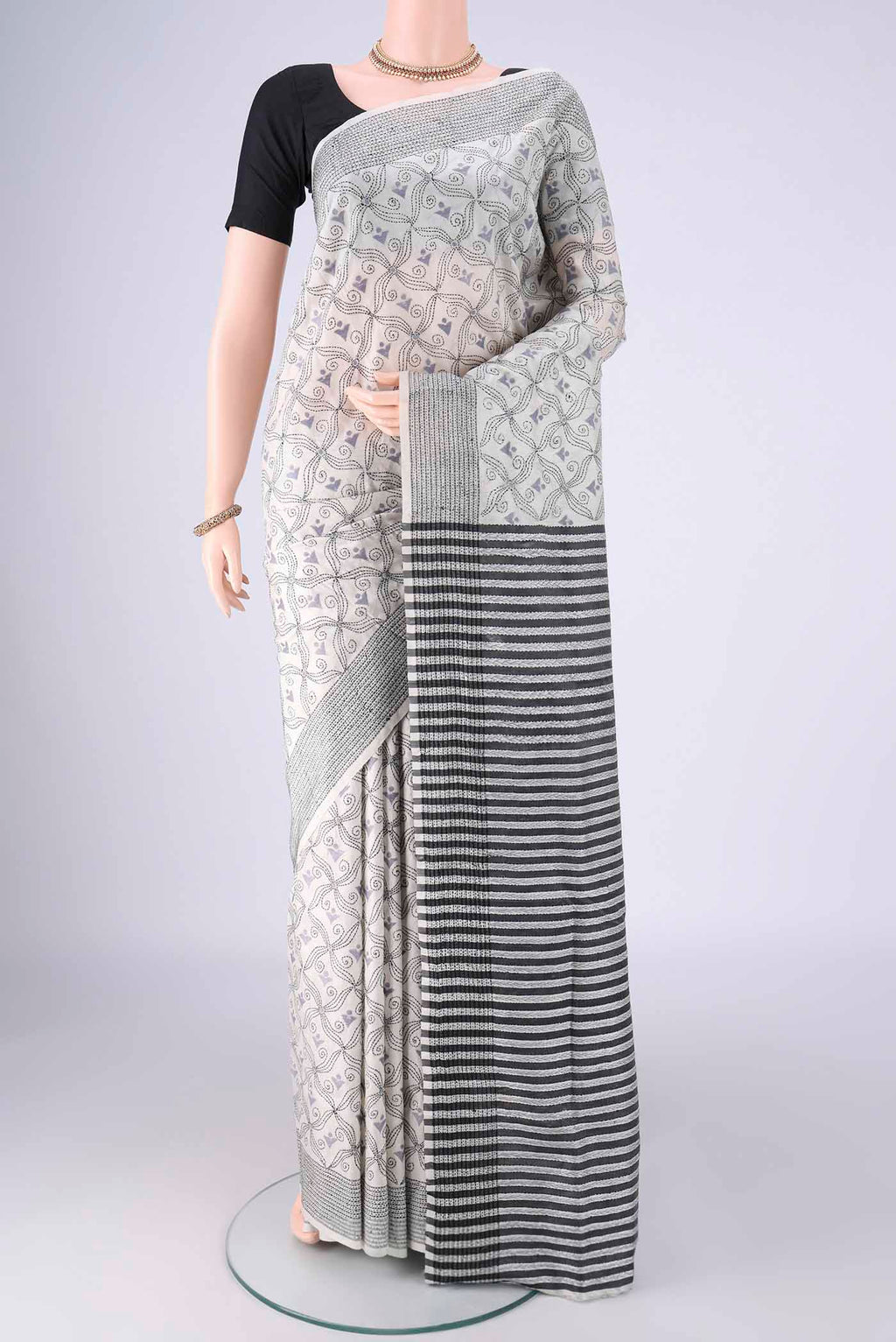 White Kantha Silk Saree with Kantha Work on the body and Thread Border.  displayed on a mannequin