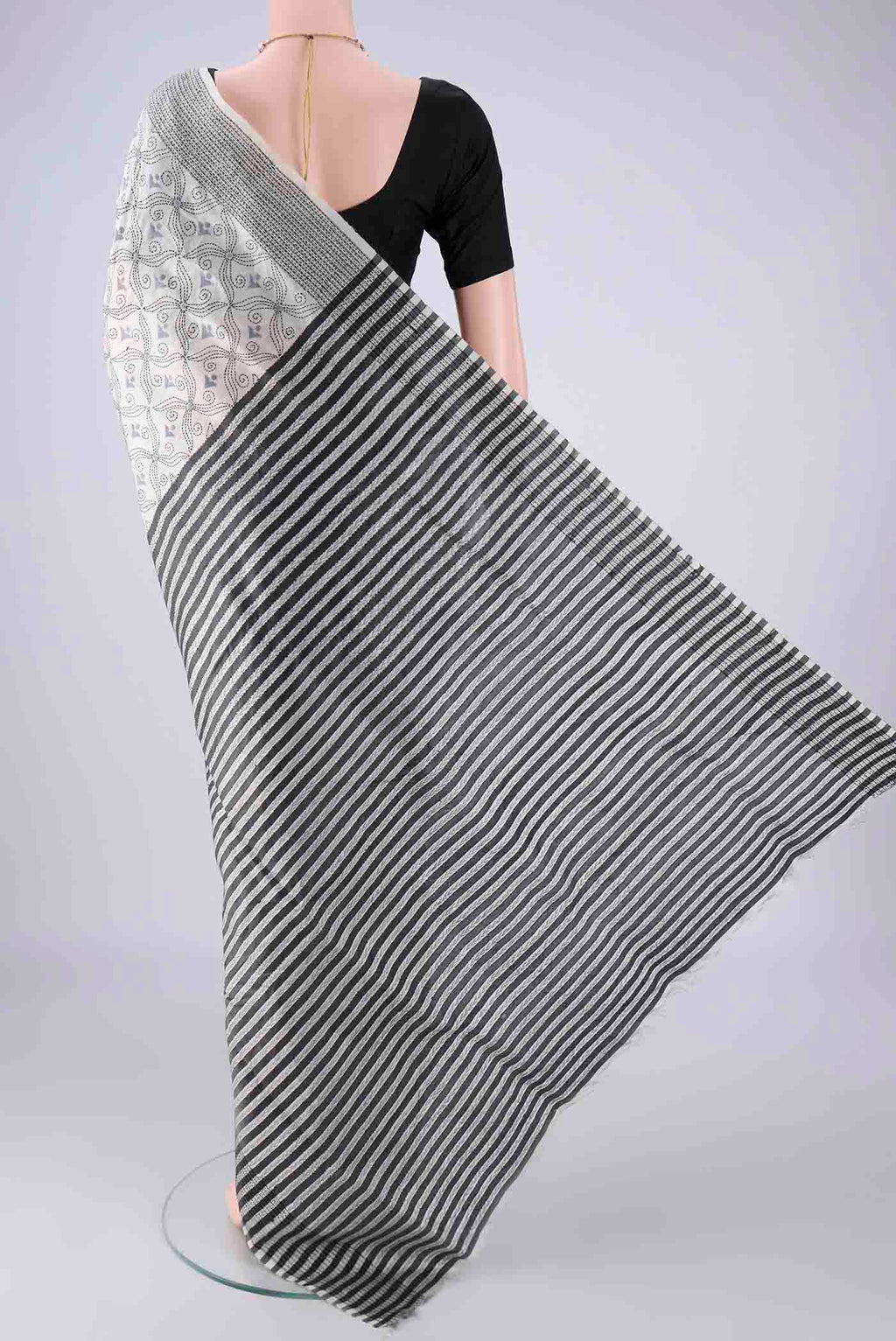 Flat view of White Kantha Silk Saree with Kantha Work on the body and Thread Border. 