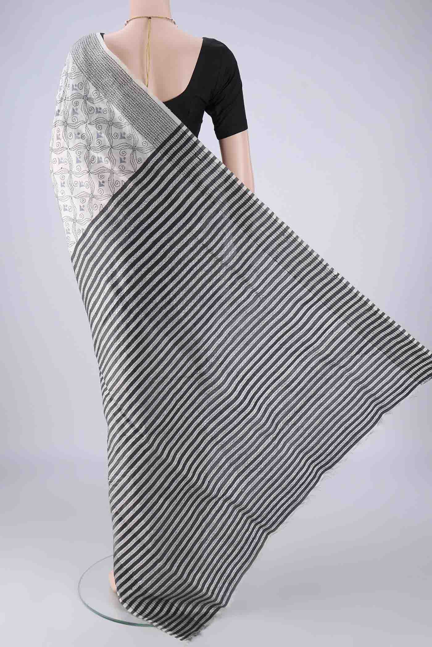 Flat view of White Kantha Silk Saree with Kantha Work on the body and Thread Border. 