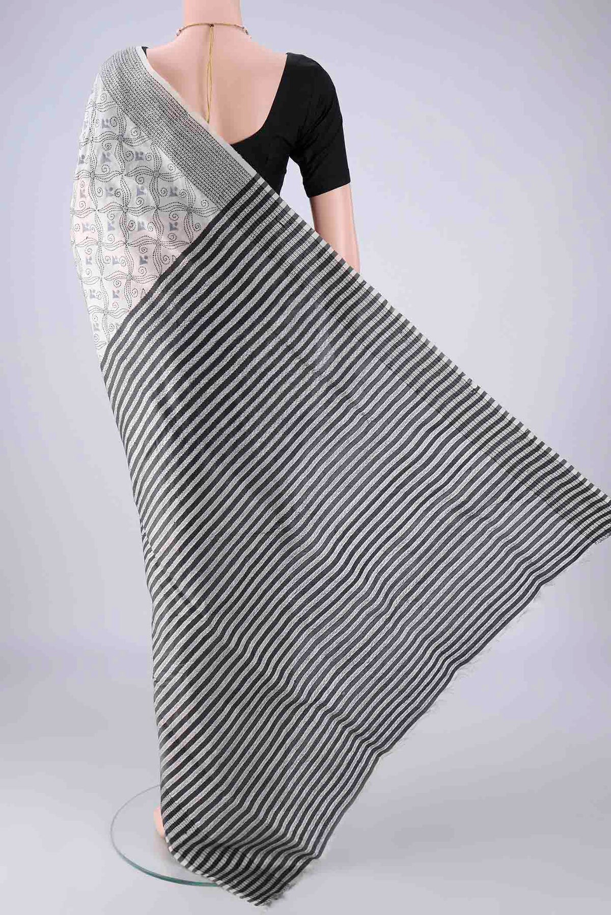 Flat view of White Kantha Silk Saree with Kantha Work on the body and Thread Border. 