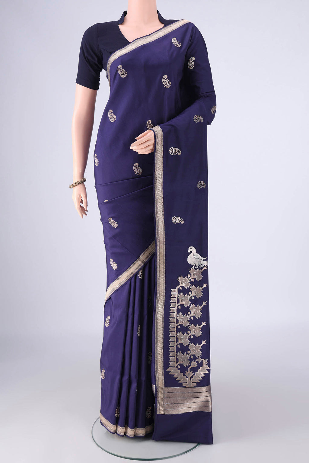Navy Blue Banarasi Silk Saree with Zari Butta on the body and Zari Border.  displayed on a mannequin
