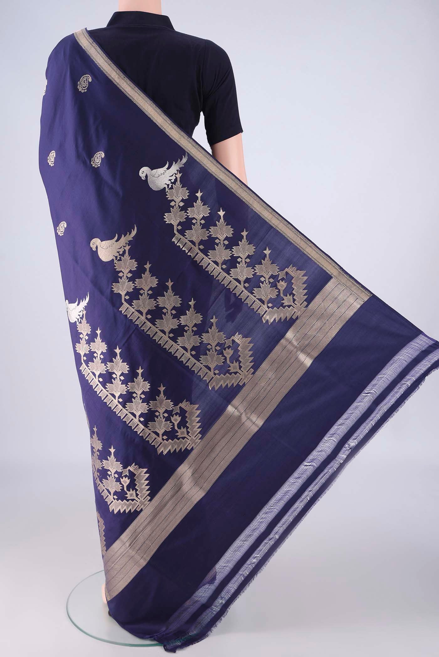 Flat view of Navy Blue Banarasi Silk Saree with Zari Butta on the body and Zari Border. 