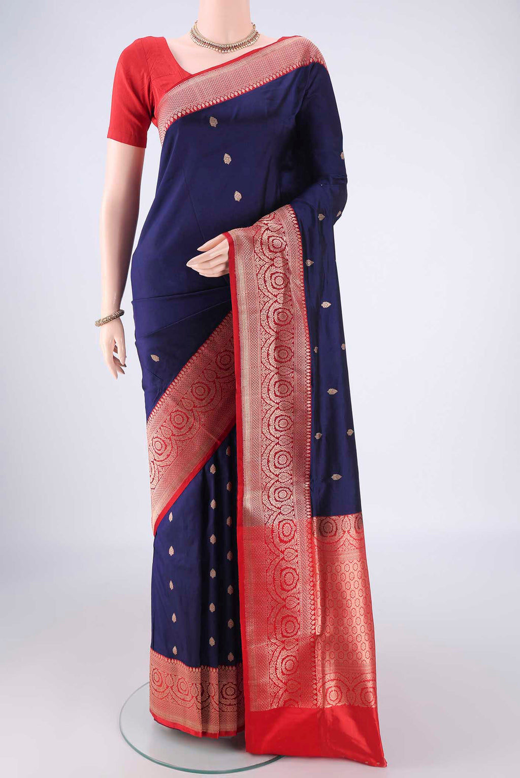 Navy Blue Dual Tone Banarasi Katan Silk Saree with Zari Butta on the body and Zari Border.  displayed on a mannequin