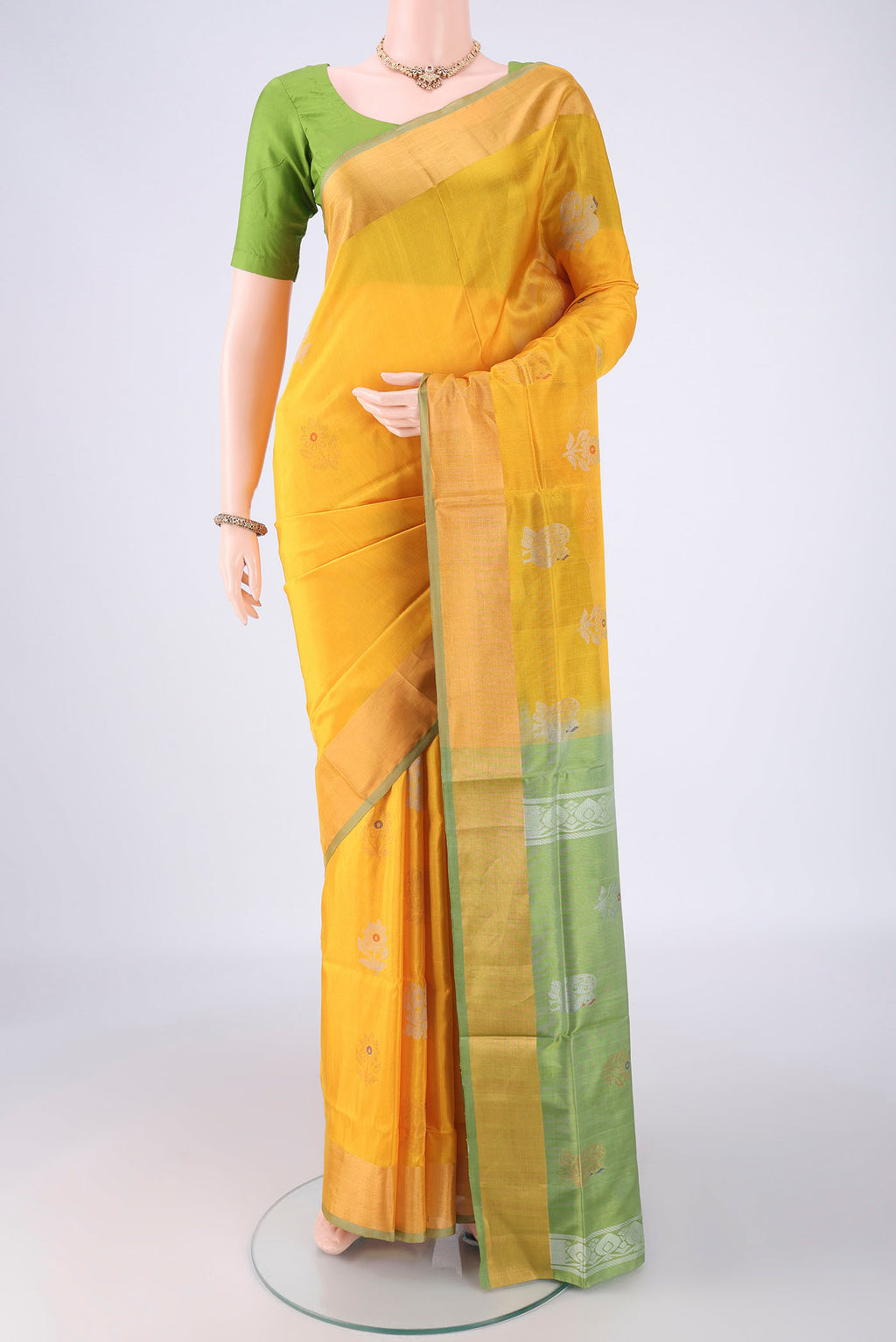 Yellow Uppada Silk Saree with Zari Butta on the body and Zari Border.  displayed on a mannequin