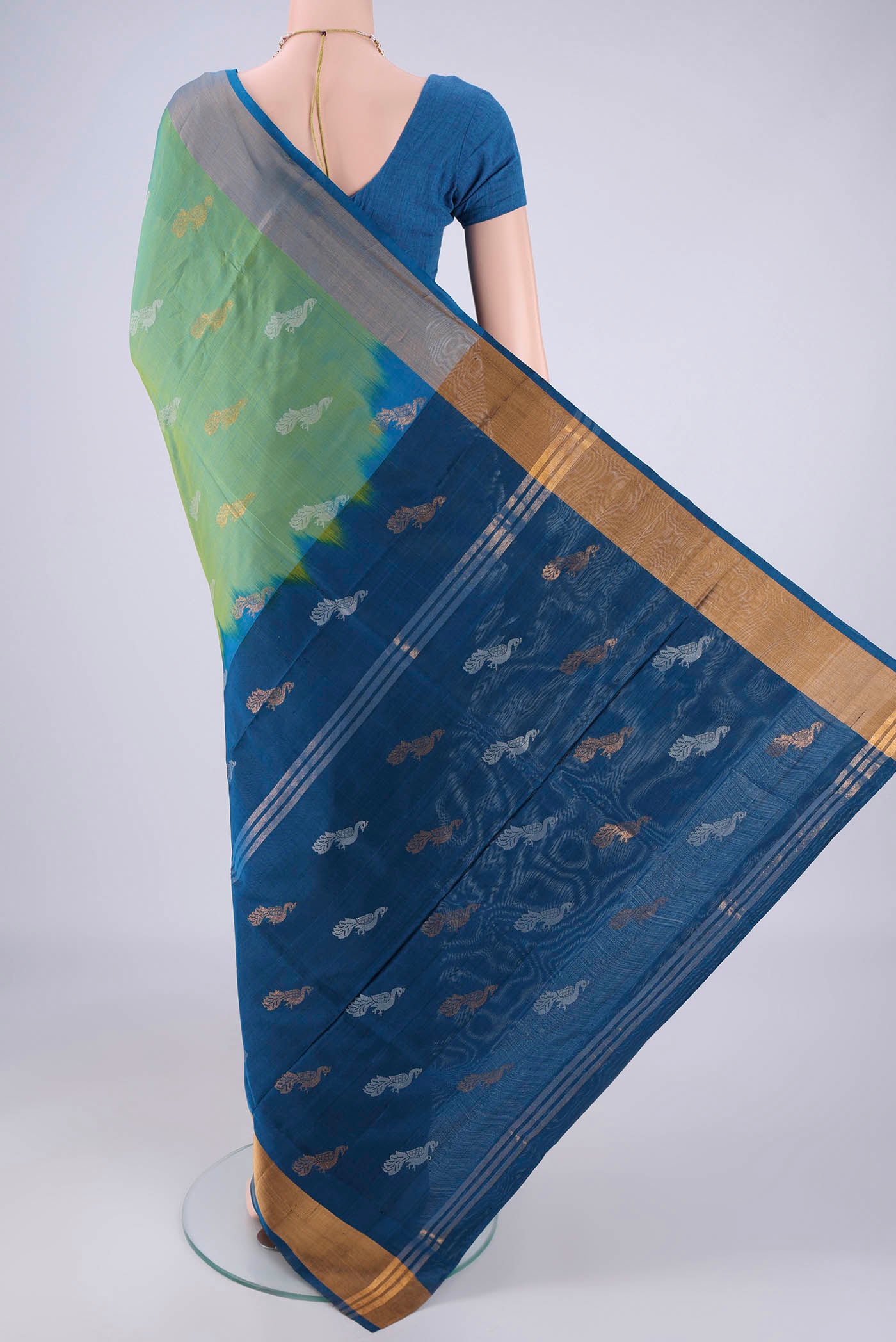 Flat view of Light Green Uppada Silk Saree with Zari And Thread Butta on the body and Zari Border. 