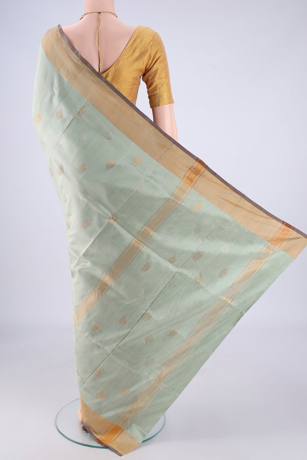Flat view of Lilac Uppada Silk Saree with Zari And Thread Butta on the body and Zari Border. 