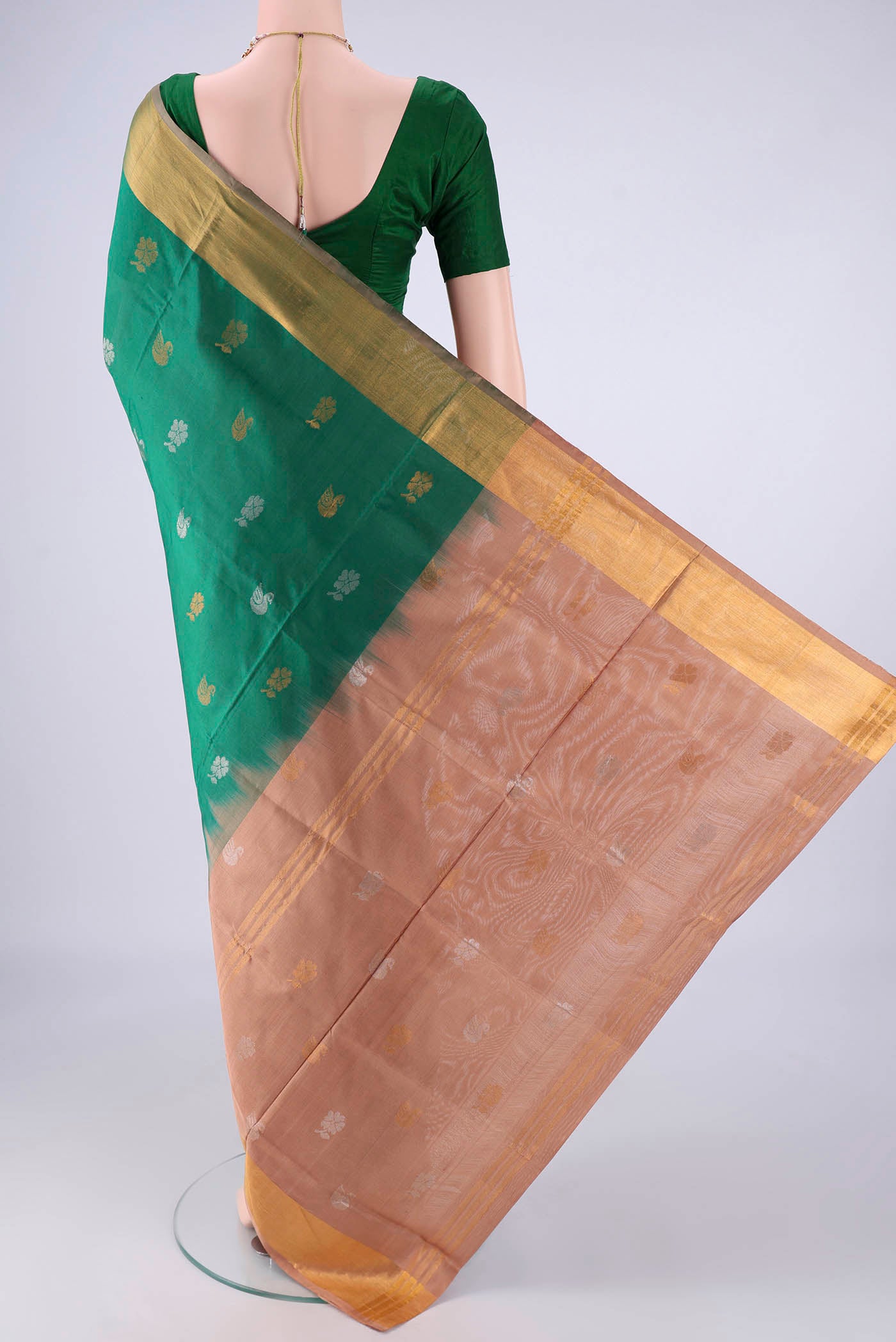 Flat view of Green Uppada Silk Saree with Zari And Thread Butta on the body and Zari Border. 