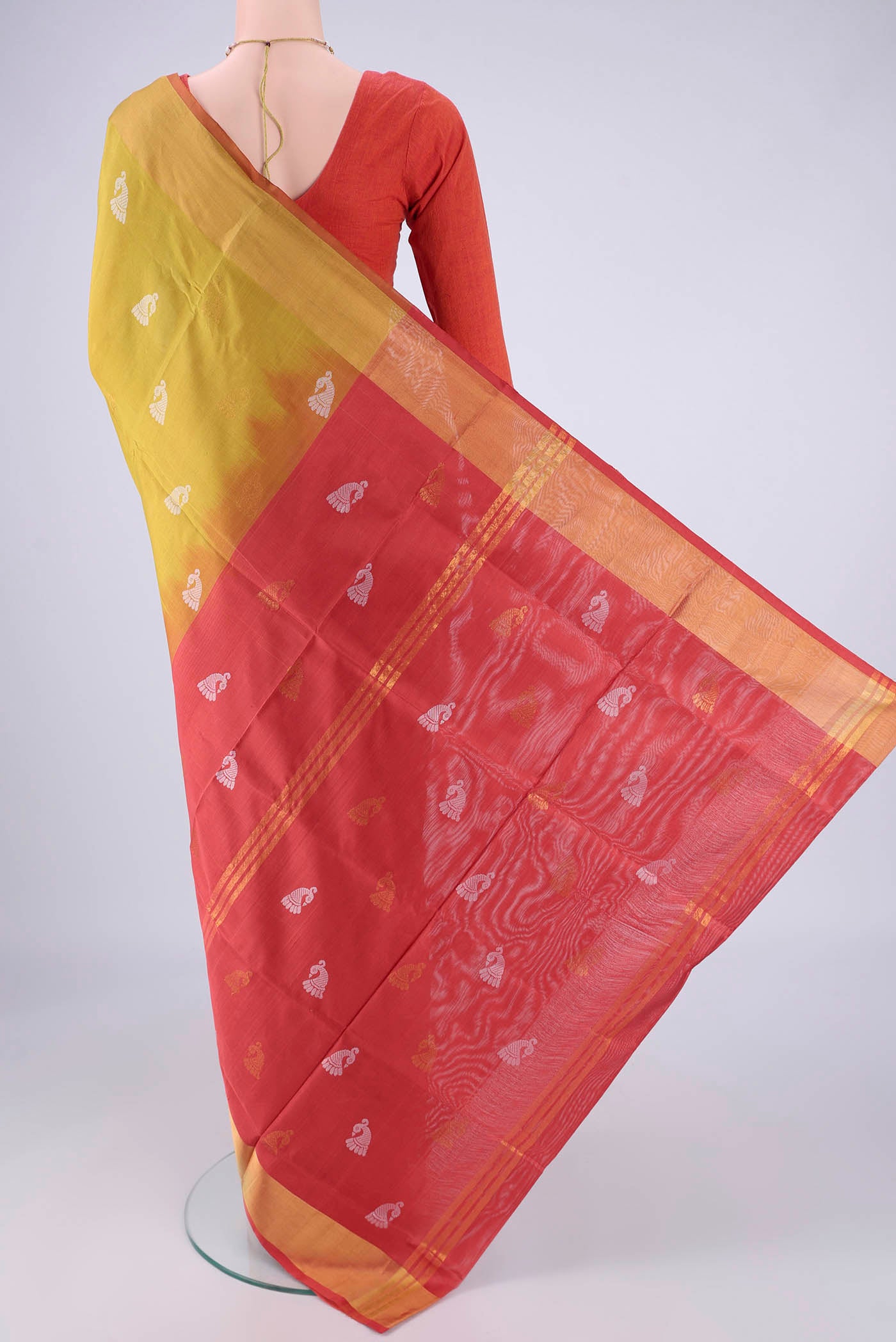 Flat view of Mustard Uppada Silk Saree with Zari And Thread Butta on the body and Zari Border. 