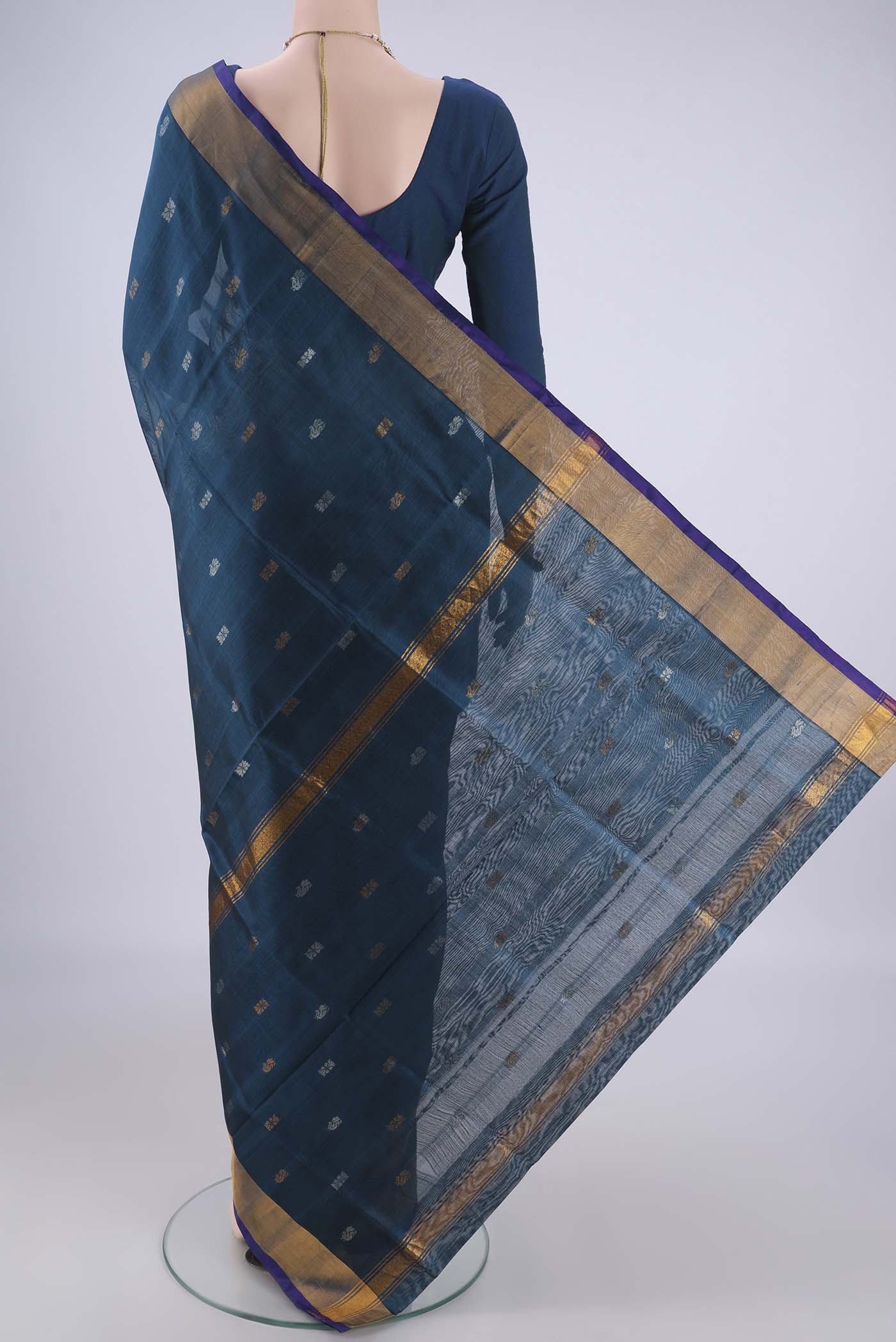 Flat view of Turquoise Uppada Silk Saree with Zari Butta on the body and Zari Border. 