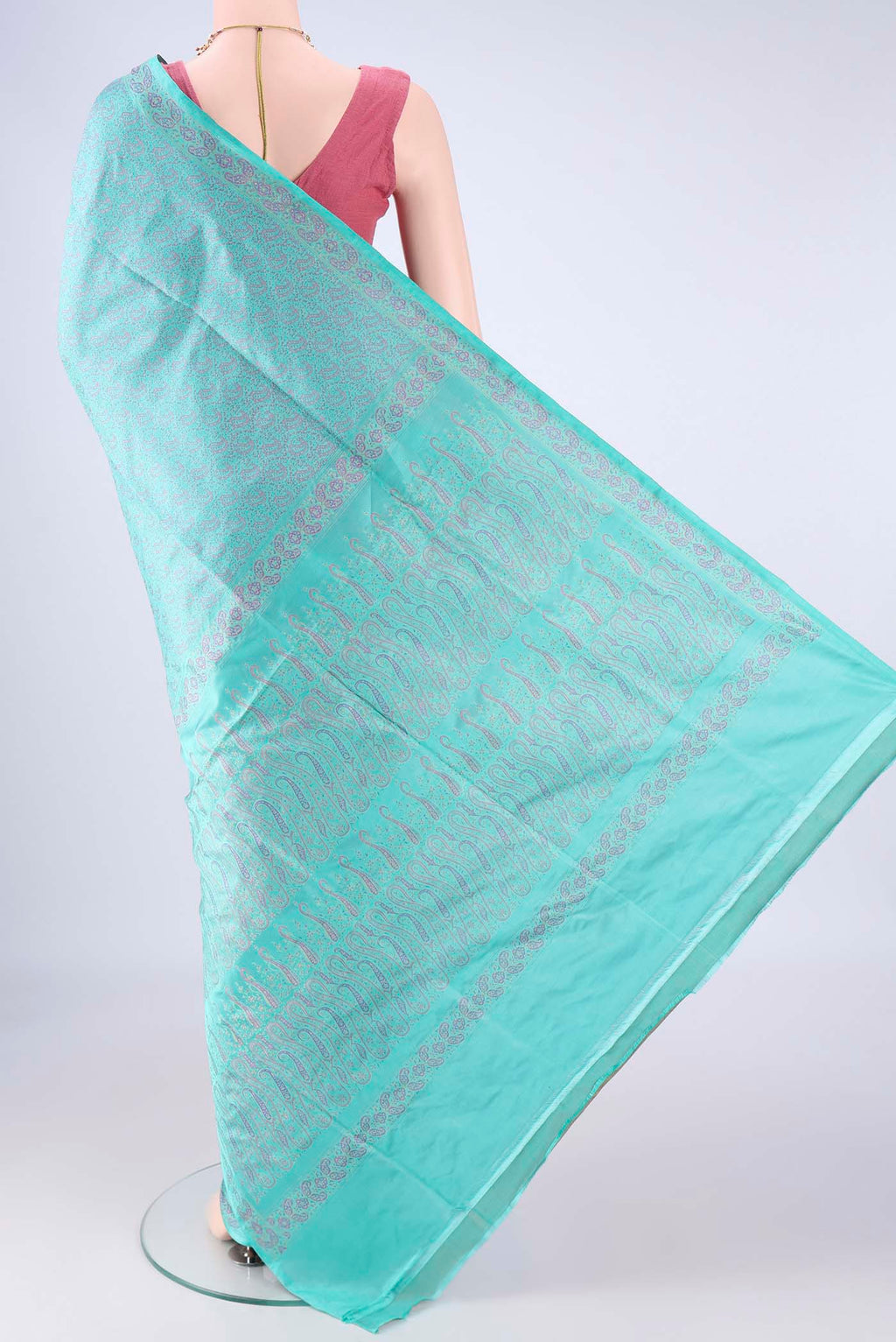 Flat view of Turquoise Banarasi Tanchoi Silk Saree with Jacquard design on the body and Zari And Thread Border. 