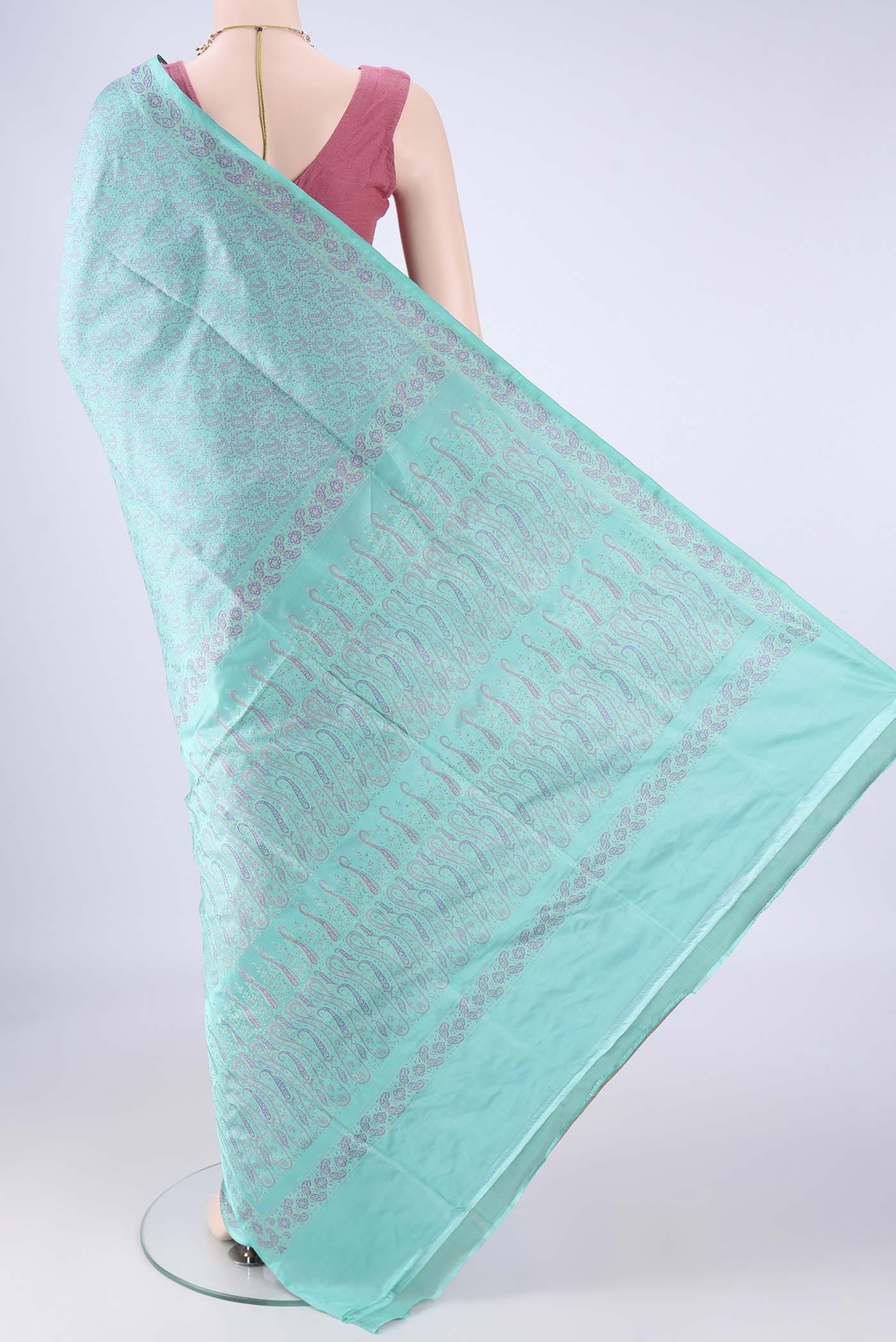 Flat view of Turquoise Banarasi Tanchoi Silk Saree with Jacquard design on the body and Zari And Thread Border. 