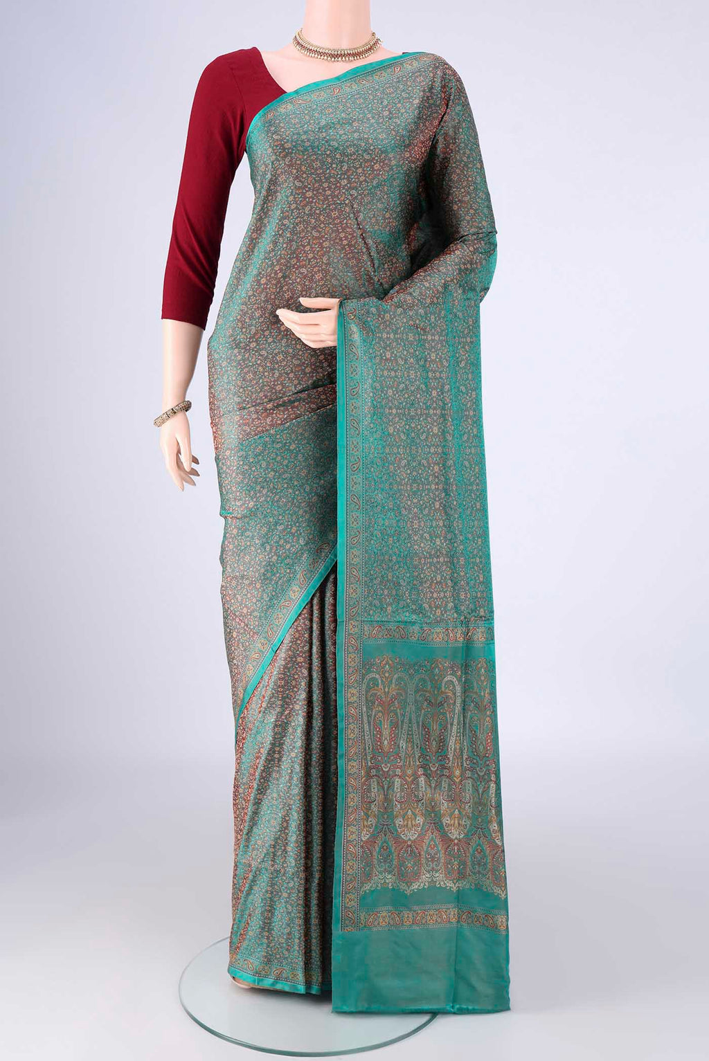 Sea Green Banarasi Tanchoi Silk Saree with Jacquard design on the body and Zari And Thread Border.  displayed on a mannequin