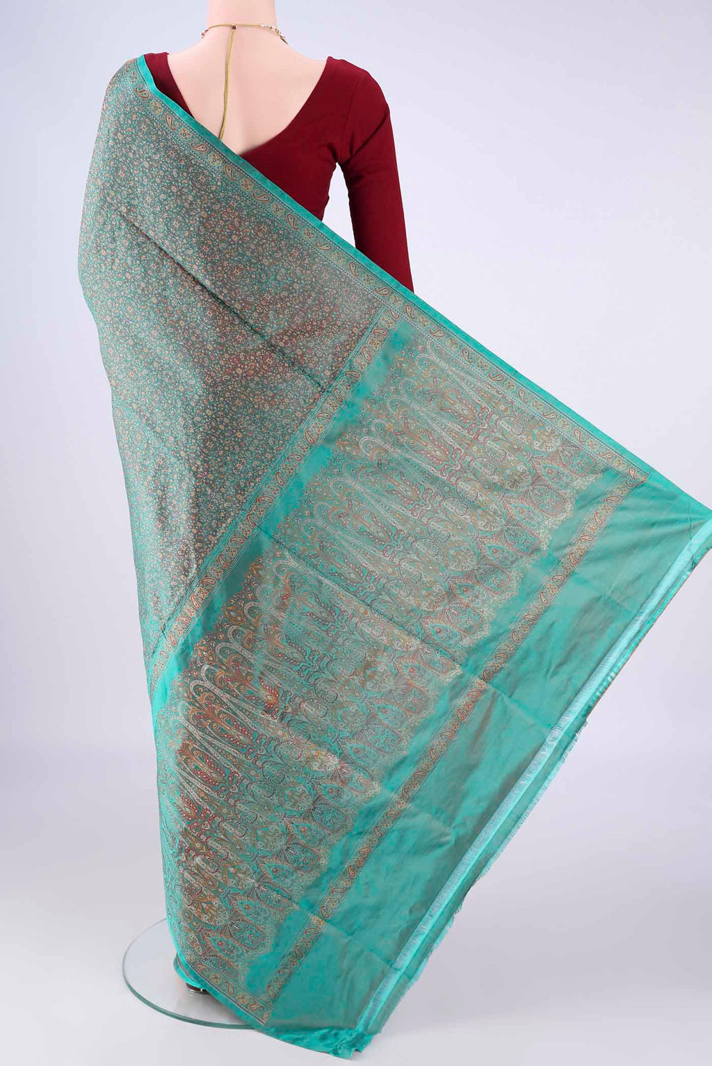 Flat view of Sea Green Banarasi Tanchoi Silk Saree with Jacquard design on the body and Zari And Thread Border. 