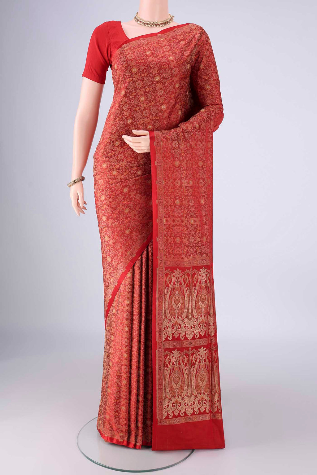 Red Banarasi Tanchoi Silk Saree with Jacquard design on the body and Zari And Thread Border.  displayed on a mannequin