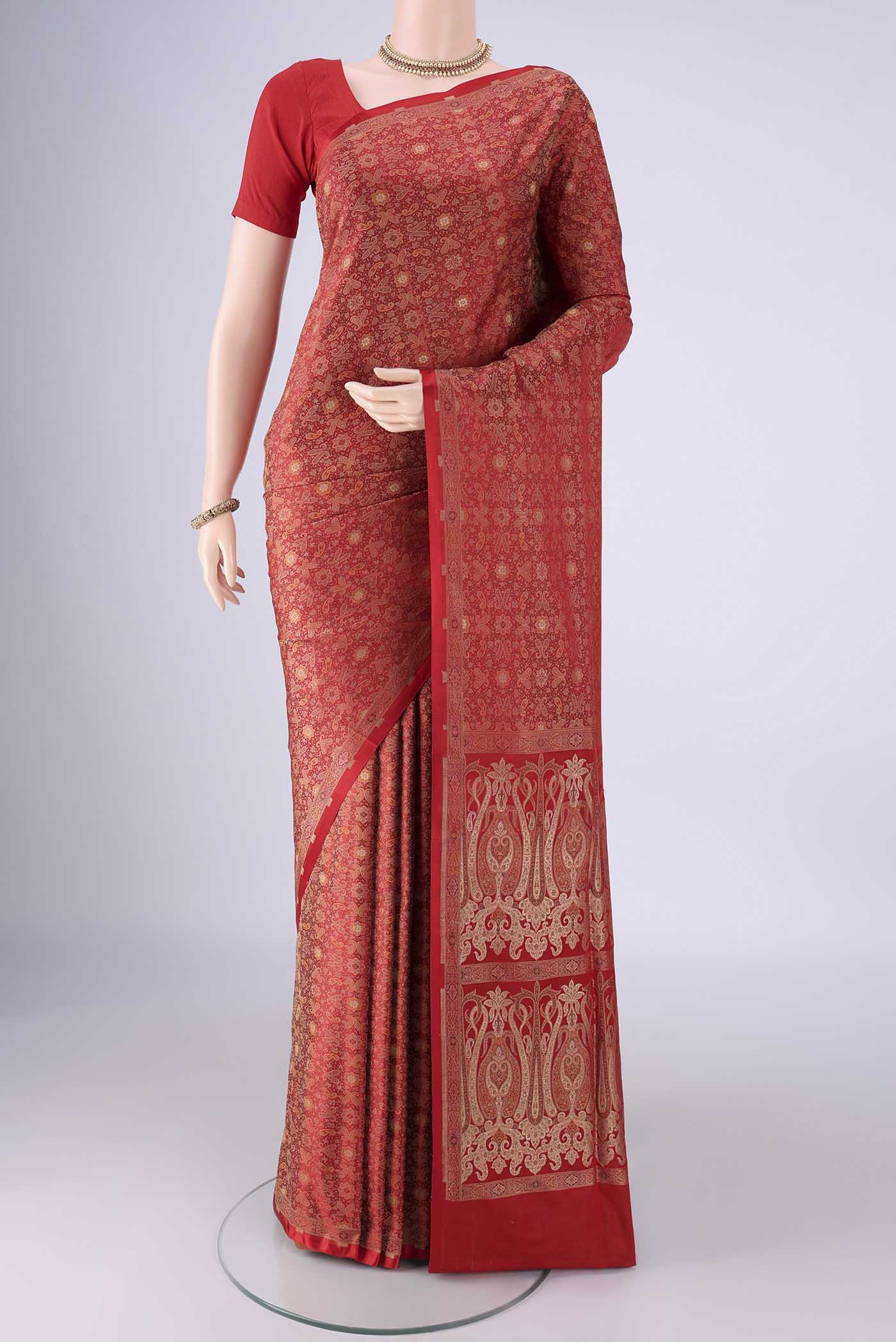 Red Banarasi Tanchoi Silk Saree with Jacquard design on the body and Zari And Thread Border.  displayed on a mannequin