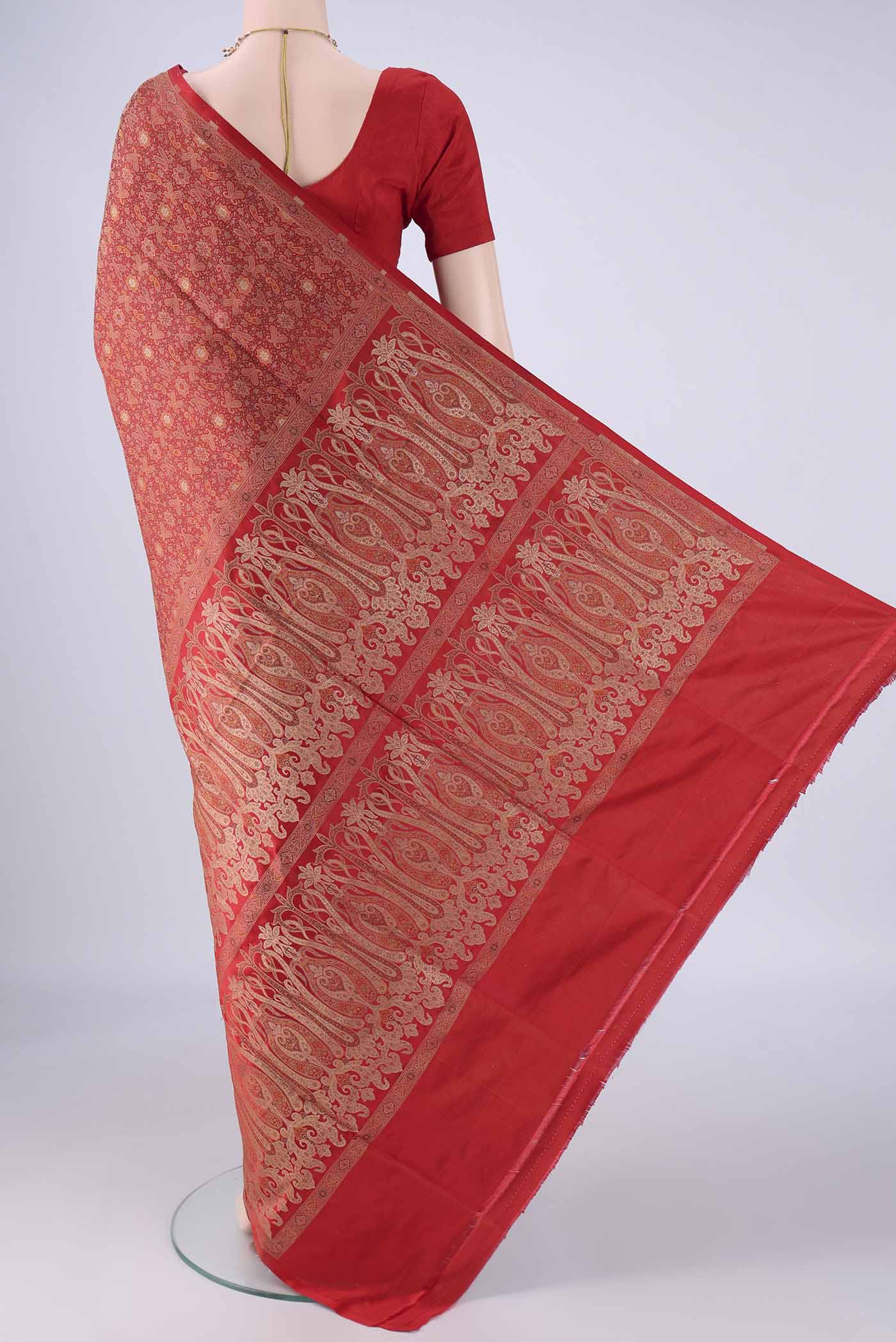 Flat view of Red Banarasi Tanchoi Silk Saree with Jacquard design on the body and Zari And Thread Border. 