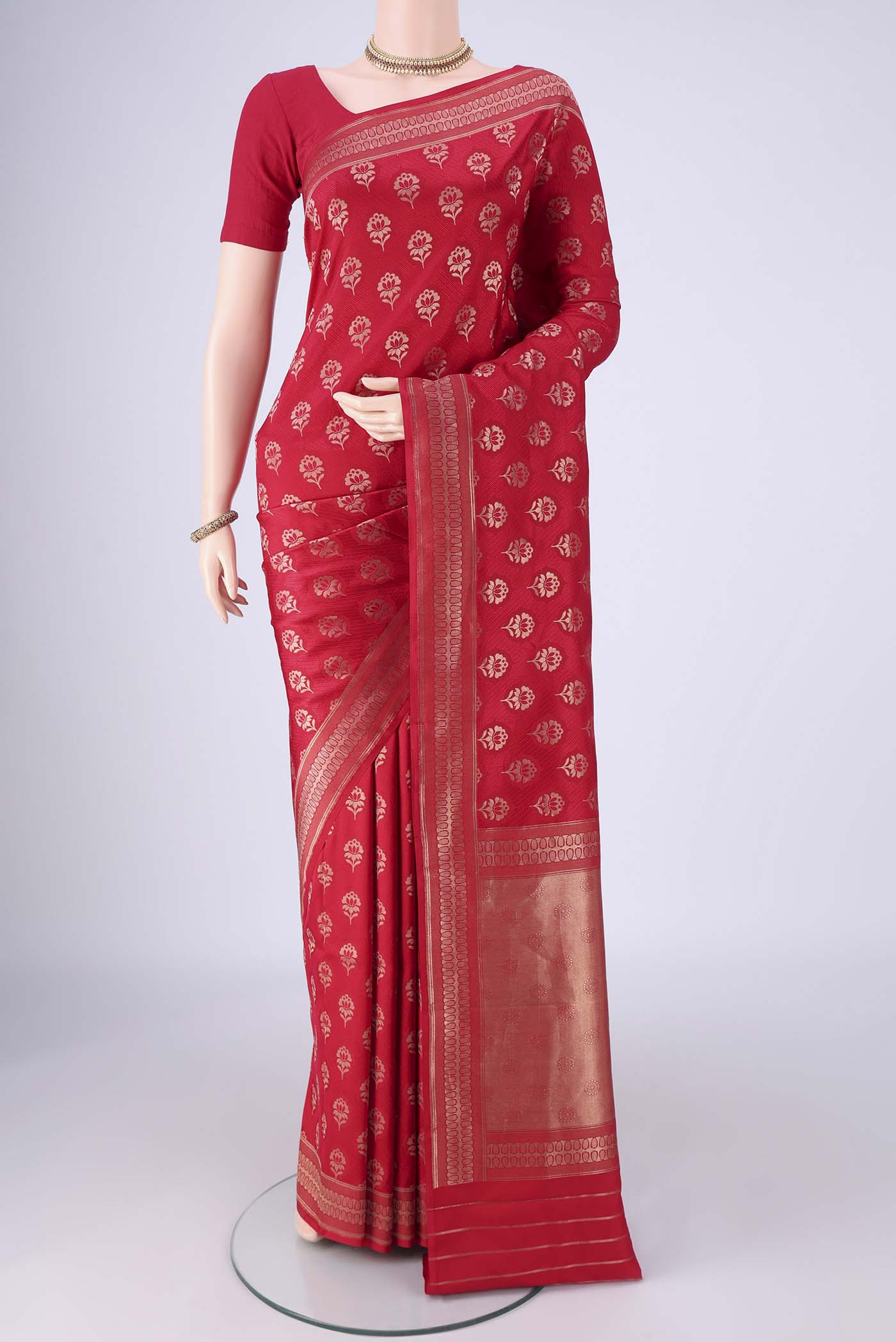 Deep Red Banarasi Silk Saree with Jacquard With Zari Butta on the body and Zari Border.  displayed on a mannequin