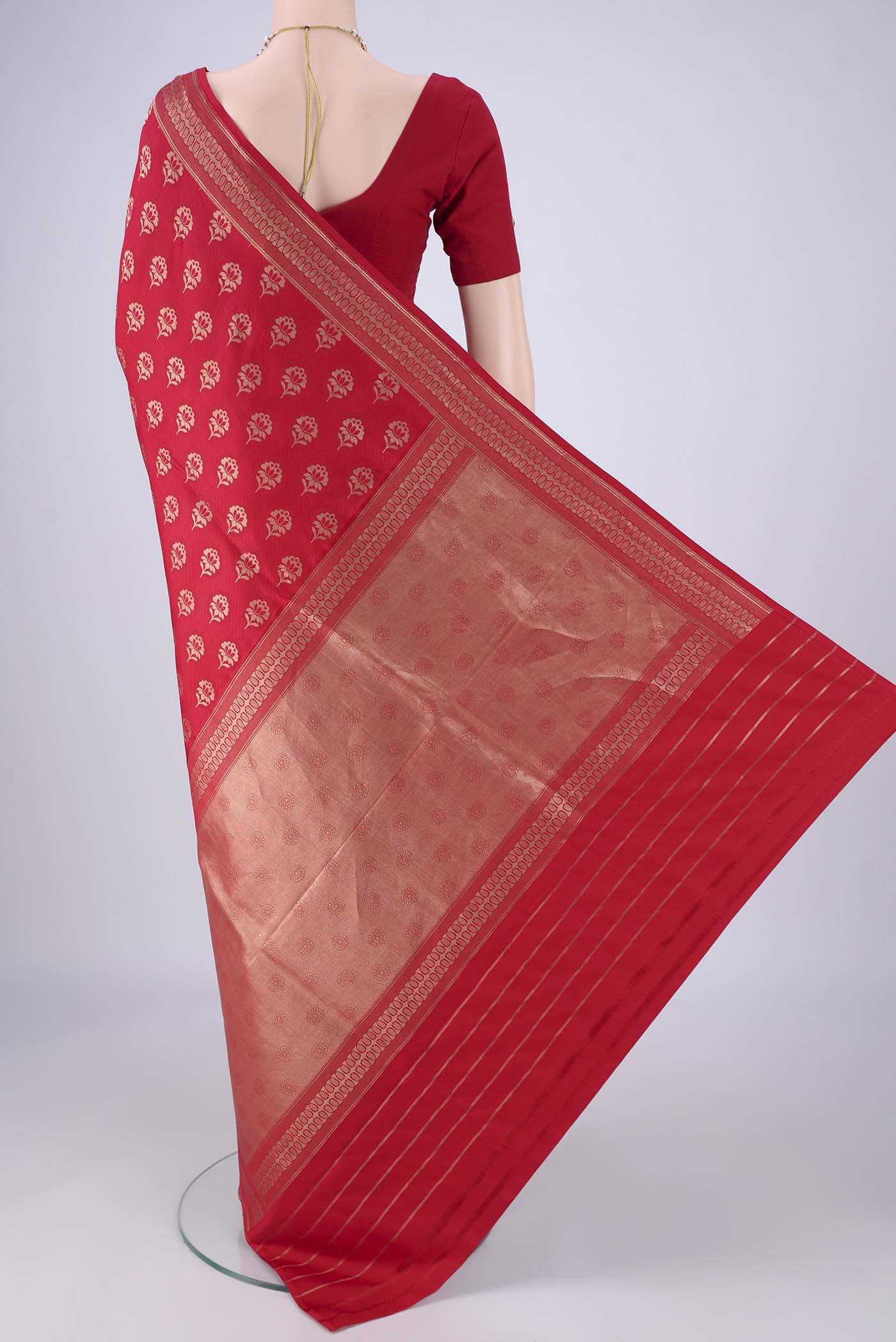 Flat view of Deep Red Banarasi Silk Saree with Jacquard With Zari Butta on the body and Zari Border. 