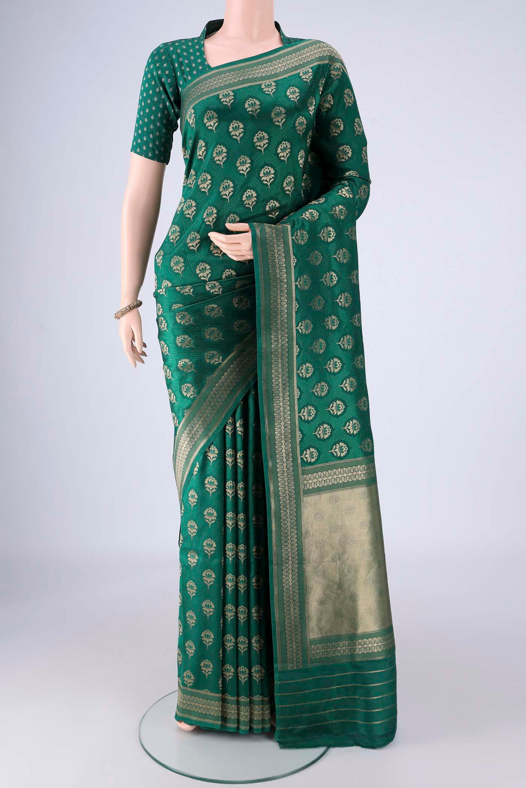Bottle Green Banarasi Silk Saree with Jacquard With Zari Butta on the body and Zari Border.  displayed on a mannequin