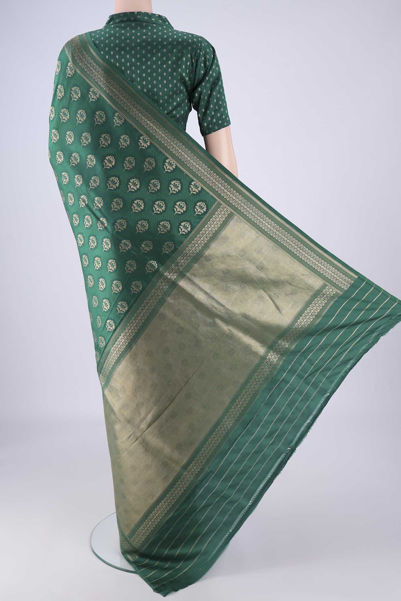 Flat view of Bottle Green Banarasi Silk Saree with Jacquard With Zari Butta on the body and Zari Border. 