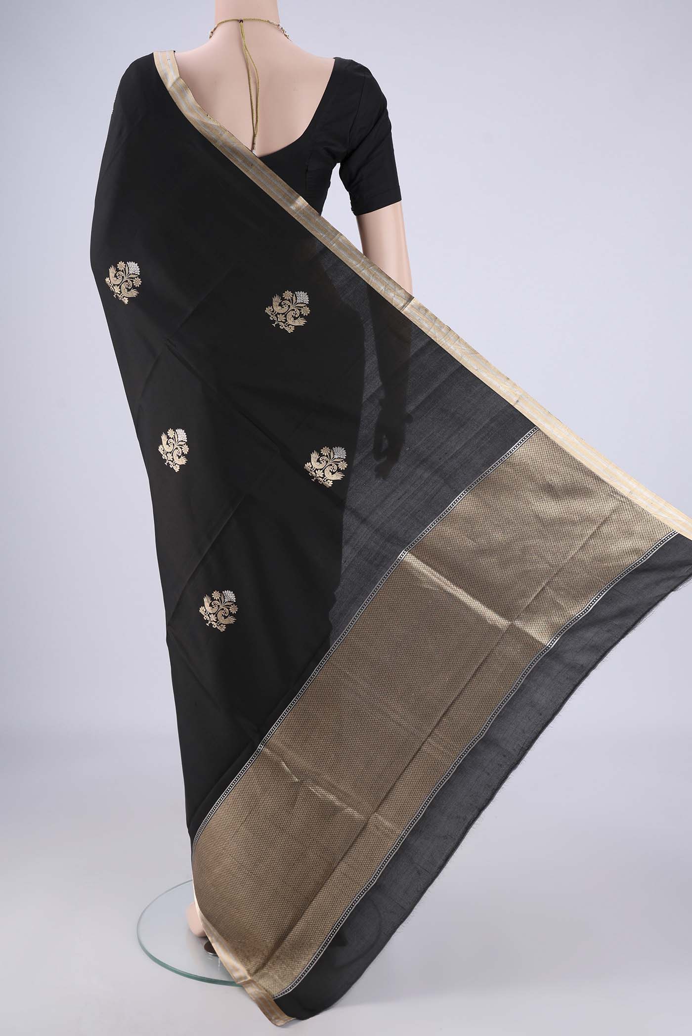 Flat view of Black Banarasi Silk Saree with Zari Butta on the body and Zari Border. 