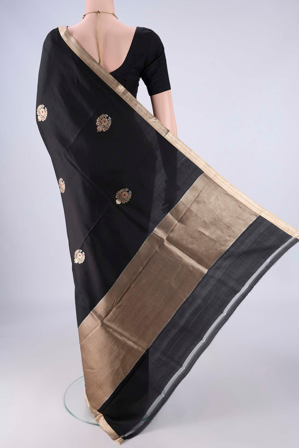 Flat view of Black Banarasi Silk Saree with Zari Butta on the body and Zari Border. 