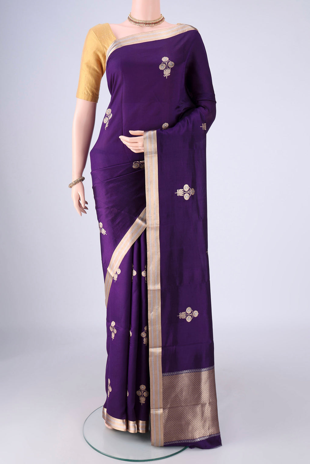 Violet Banarasi Silk Saree with Zari Butta on the body and Zari Border.  displayed on a mannequin