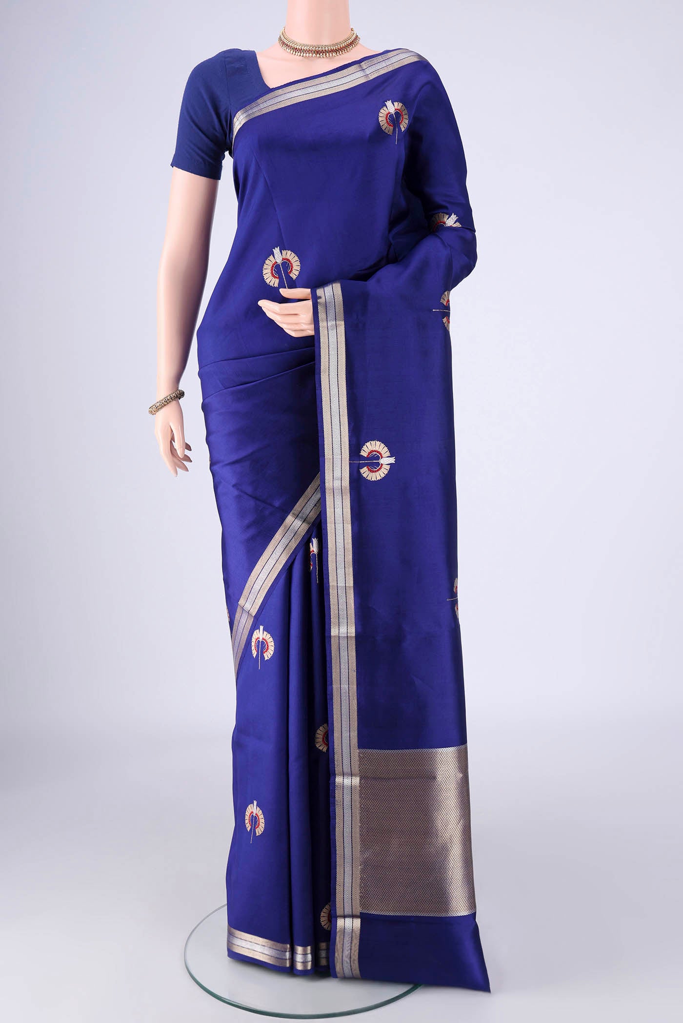 Blue Banarasi Silk Saree with Zari And Thread Butta on the body and Zari Border.  displayed on a mannequin