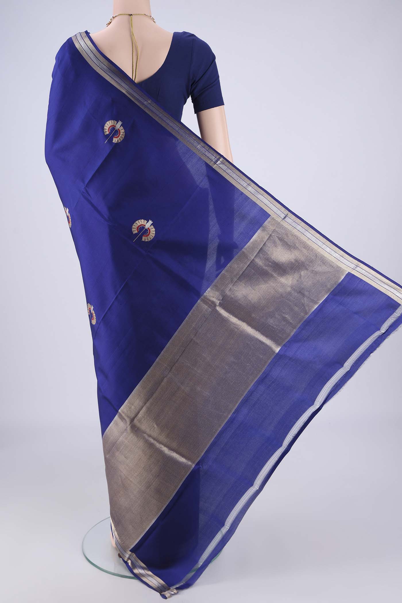 Flat view of Blue Banarasi Silk Saree with Zari And Thread Butta on the body and Zari Border. 