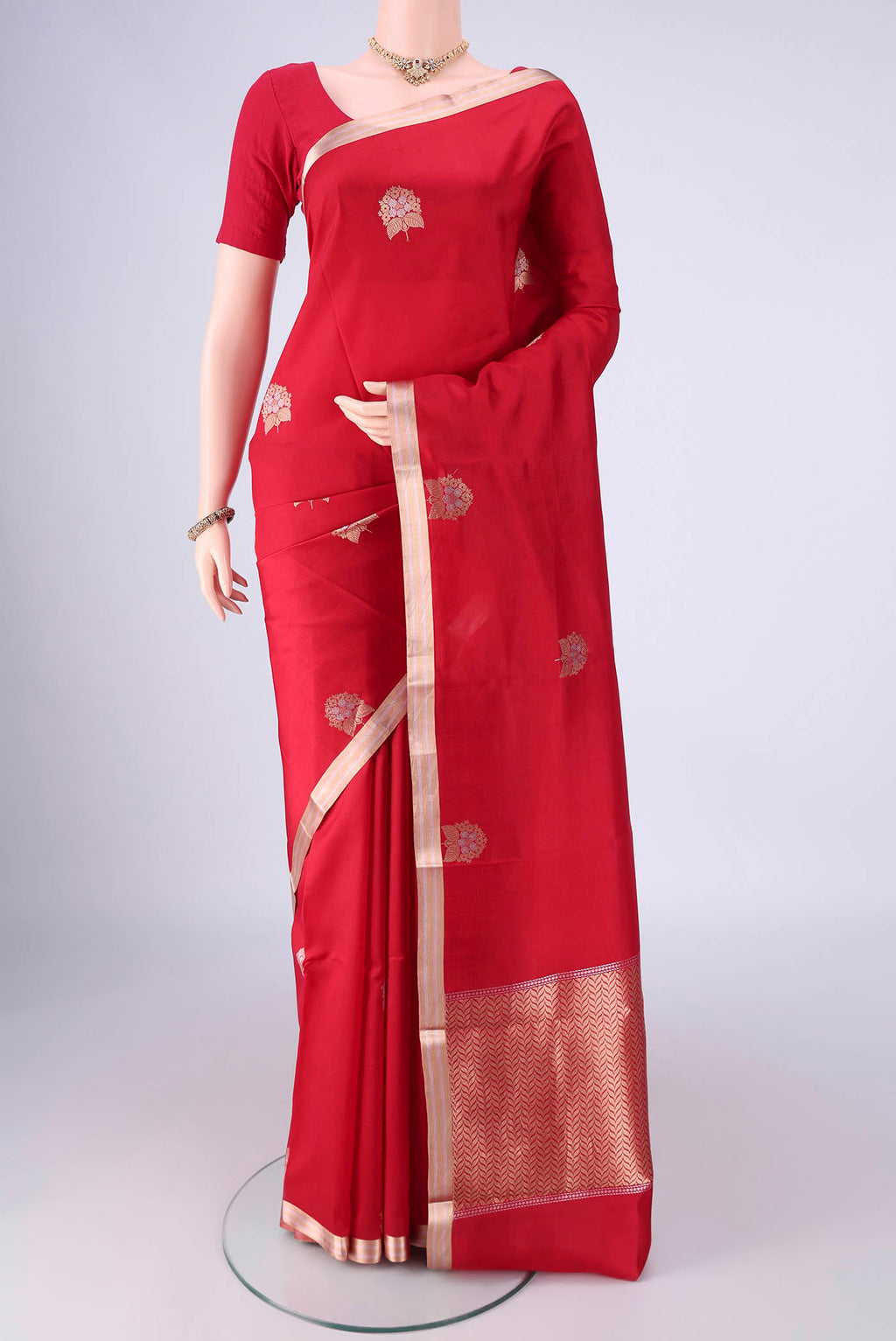 Red Banarasi Silk Saree with Zari Butta on the body and Zari Border.  displayed on a mannequin