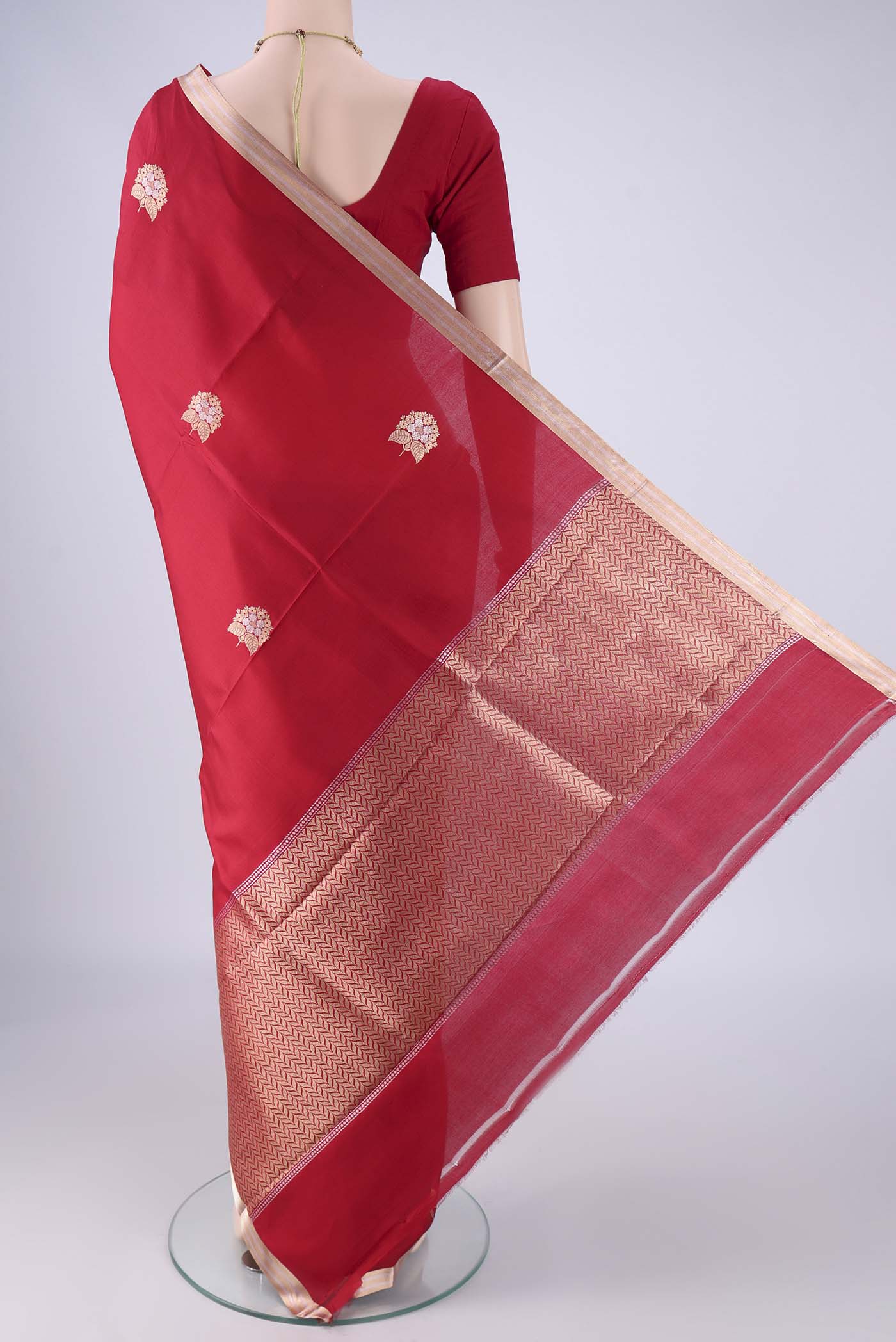 Flat view of Red Banarasi Silk Saree with Zari Butta on the body and Zari Border. 
