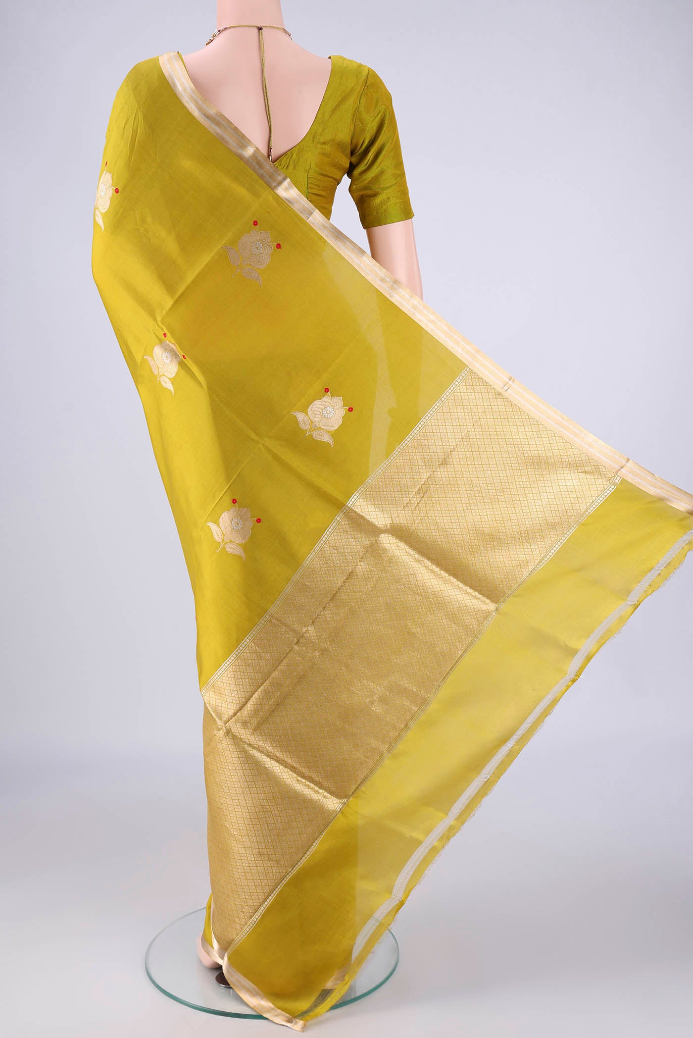 Flat view of Mehandi Green Banarasi Silk Saree with Zari Butta on the body and Zari Border. 
