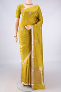 Pure Silk Mehandi Green Banarasi Saree with Zari Butta on the body and Zari Border.  displayed on a mannequin