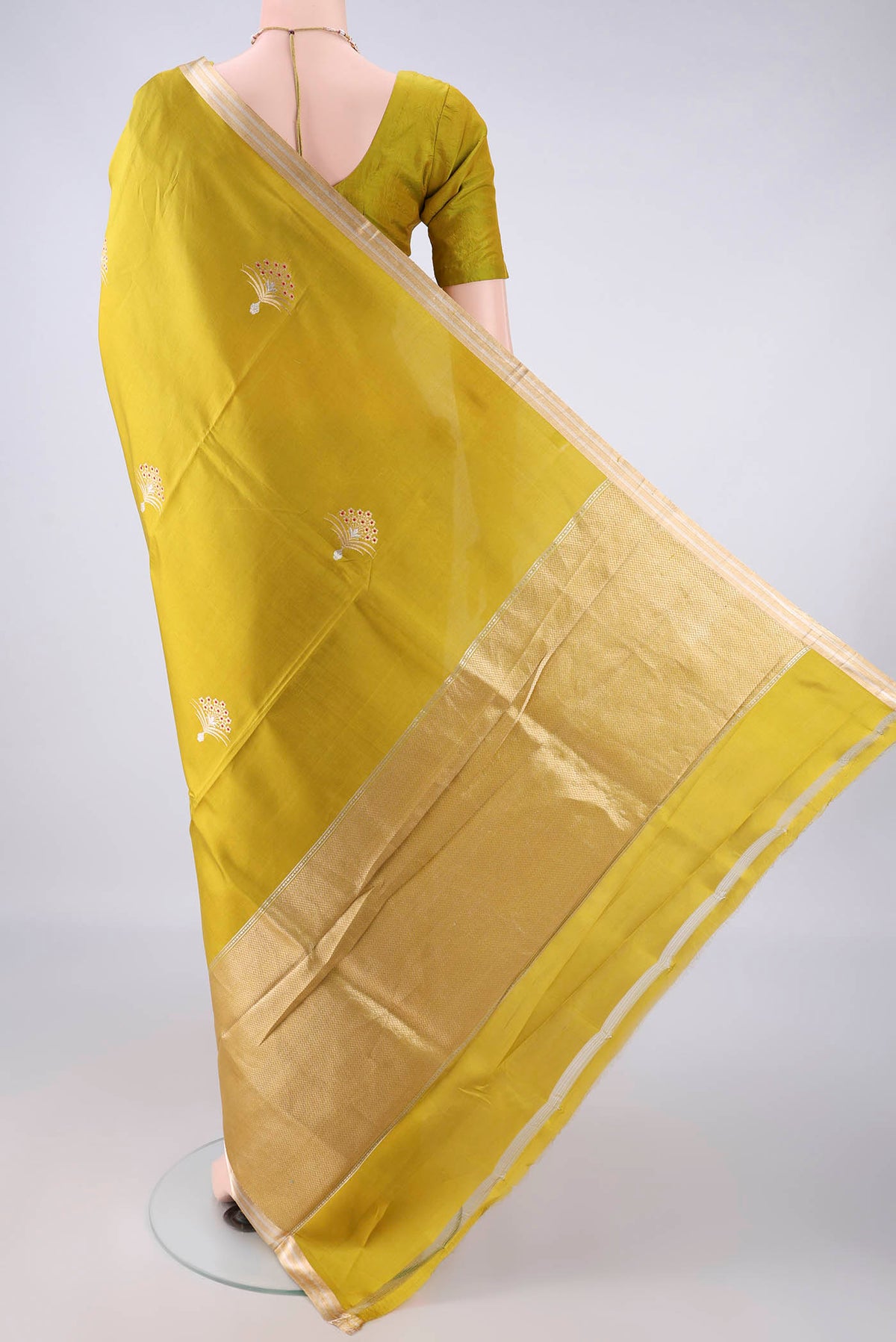 Flat view of Pure Silk Mehandi Green Banarasi Saree with Zari Butta on the body and Zari Border. 