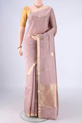 Rose Gold Banarasi Silk Saree with Zari Butta on the body and Zari Border.  displayed on a mannequin