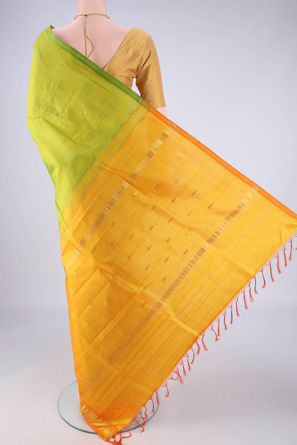 Flat view of Green Kanchipuram Silk Saree with Zari Butta on the body and One Side Border. 