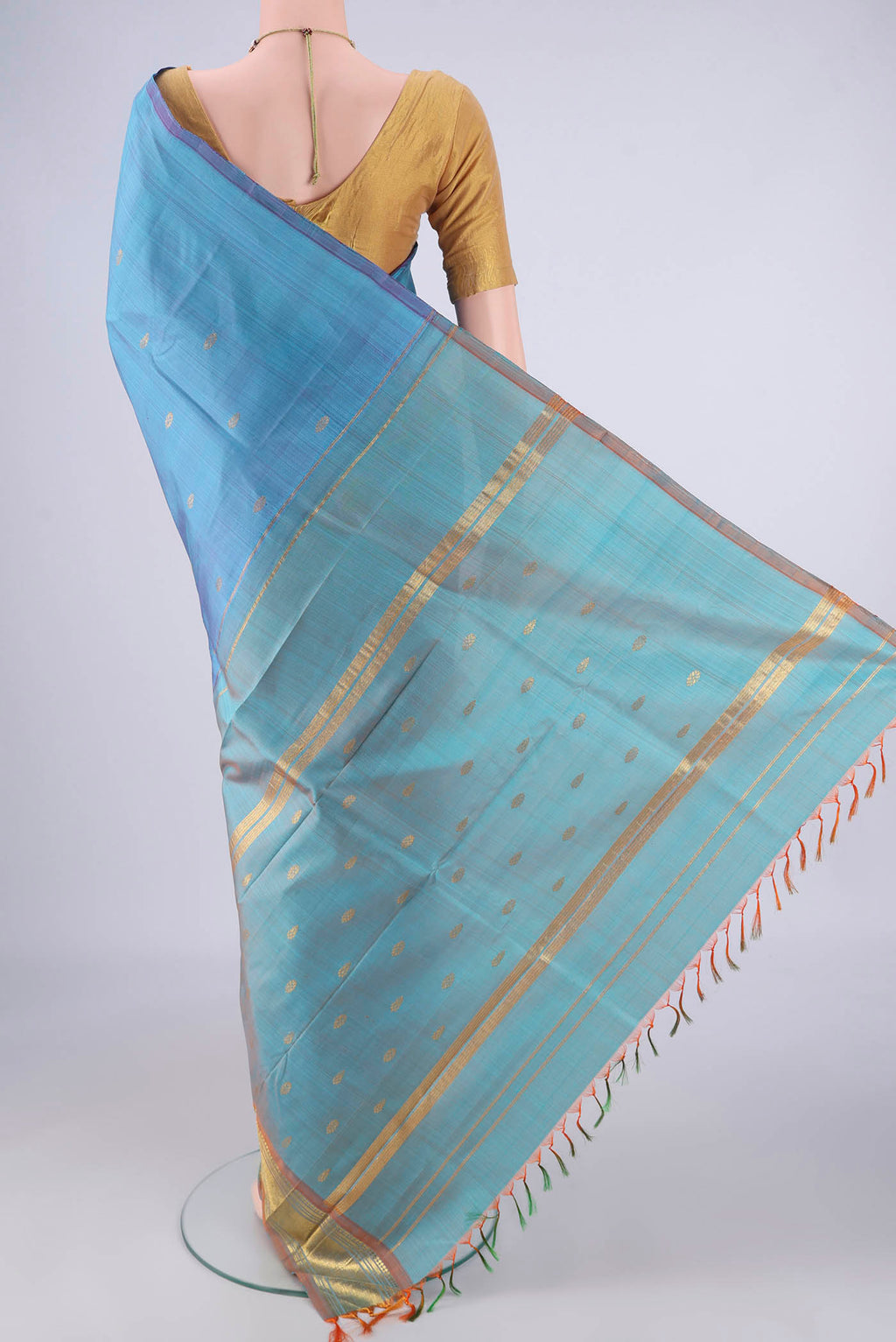 Flat view of Sky Blue Kanjivaram Silk Saree with Zari Butta on the body and One Side Border. 