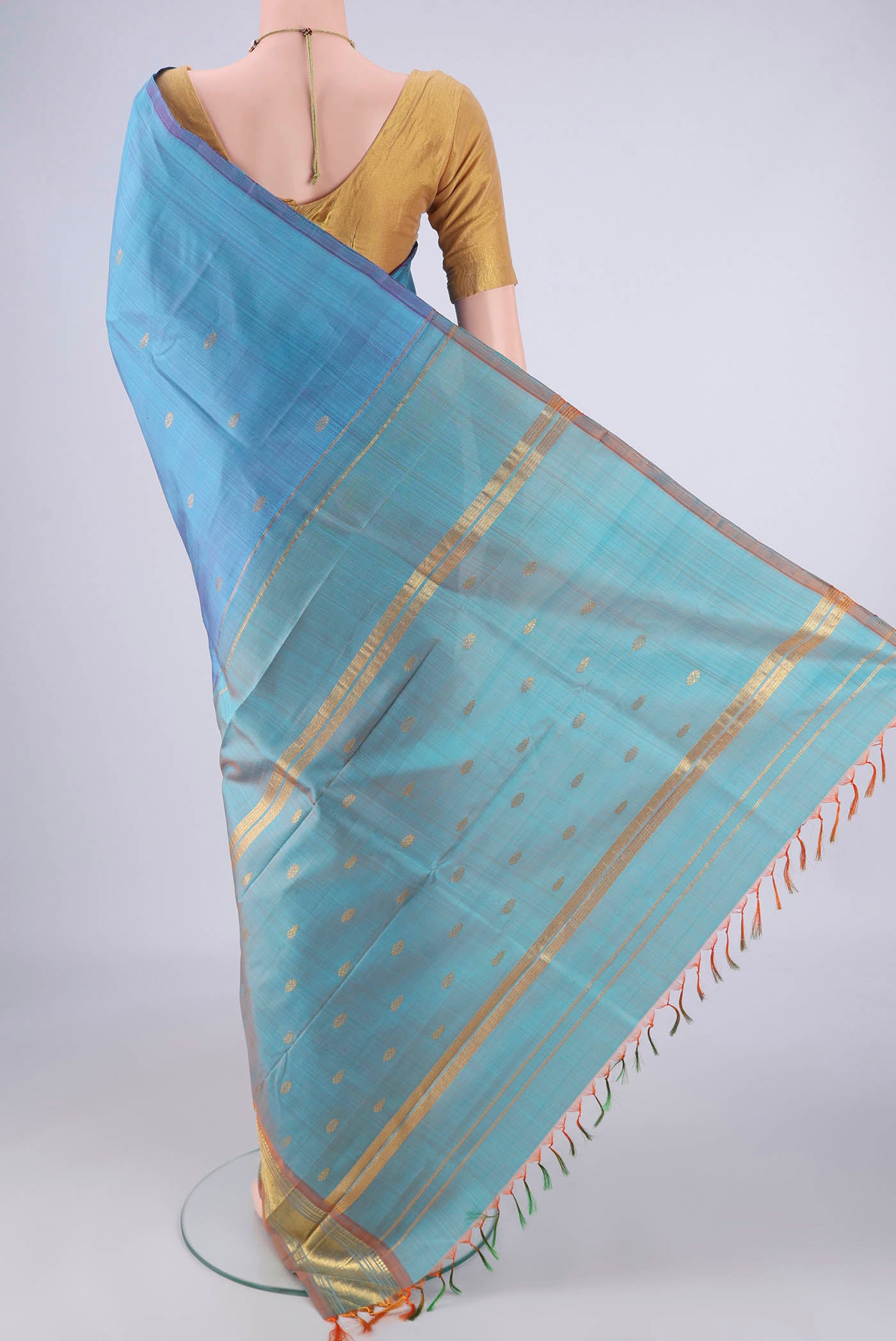 Flat view of Sky Blue Kanjivaram Silk Saree with Zari Butta on the body and One Side Border. 