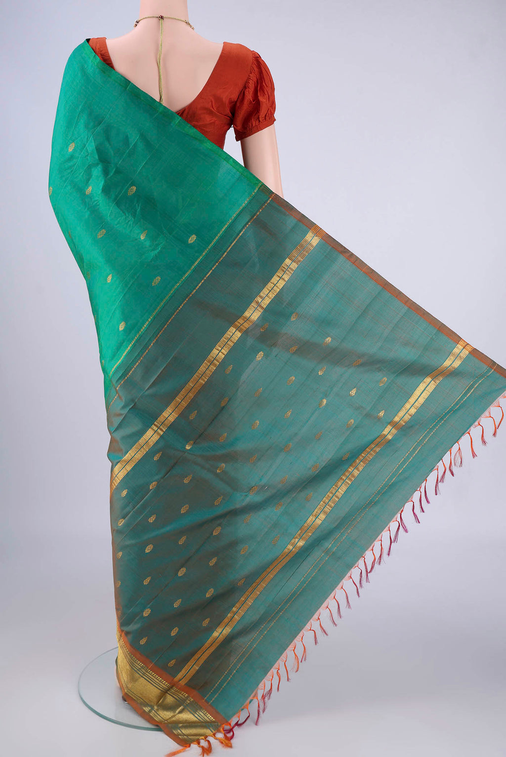 Flat view of Sea Green Kanjivaram Silk Saree with Zari Butta on the body and One Side Border. 