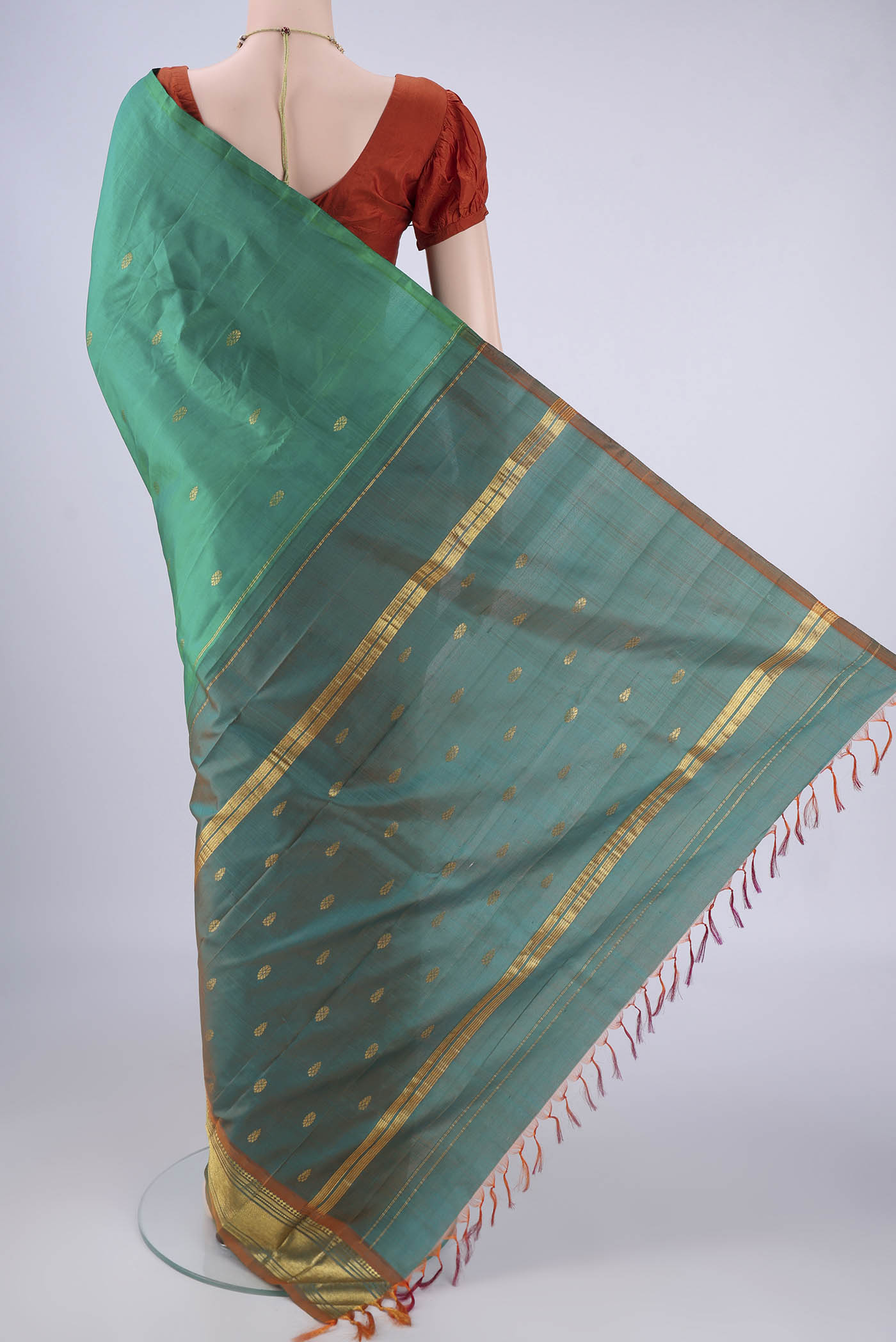 Flat view of Sea Green Kanjivaram Silk Saree with Zari Butta on the body and One Side Border. 