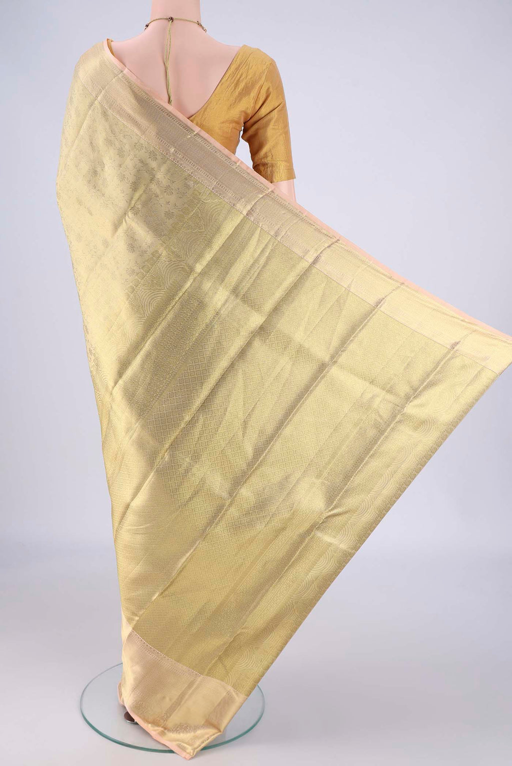 Flat view of Golden Dual Tone Kanchipuram Tissue Silk Saree with Zari Brocade on the body and Zari Border. 
