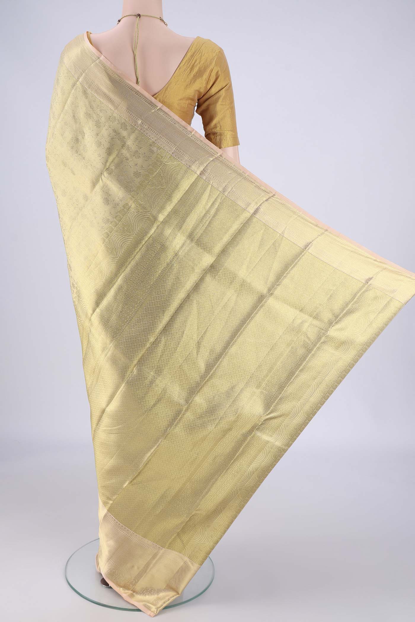 Flat view of Golden Dual Tone Kanchipuram Tissue Silk Saree with Zari Brocade on the body and Zari Border. 