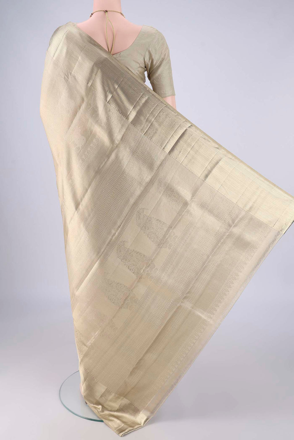 Flat view of Golden Kanjivaram Tissue Silk Saree with Zari Brocade on the body and Zari Border. 