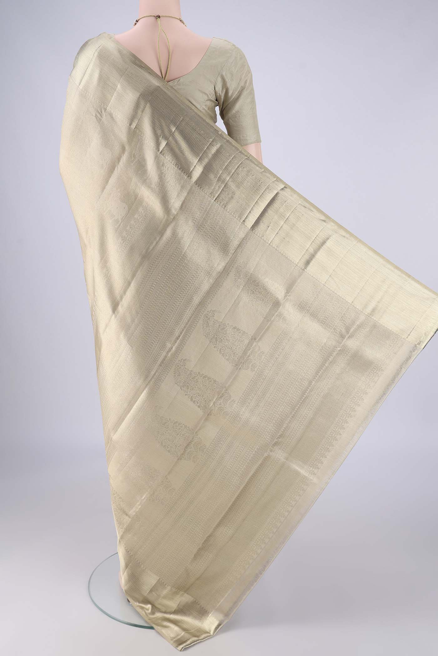 Flat view of Golden Kanjivaram Tissue Silk Saree with Zari Brocade on the body and Zari Border. 