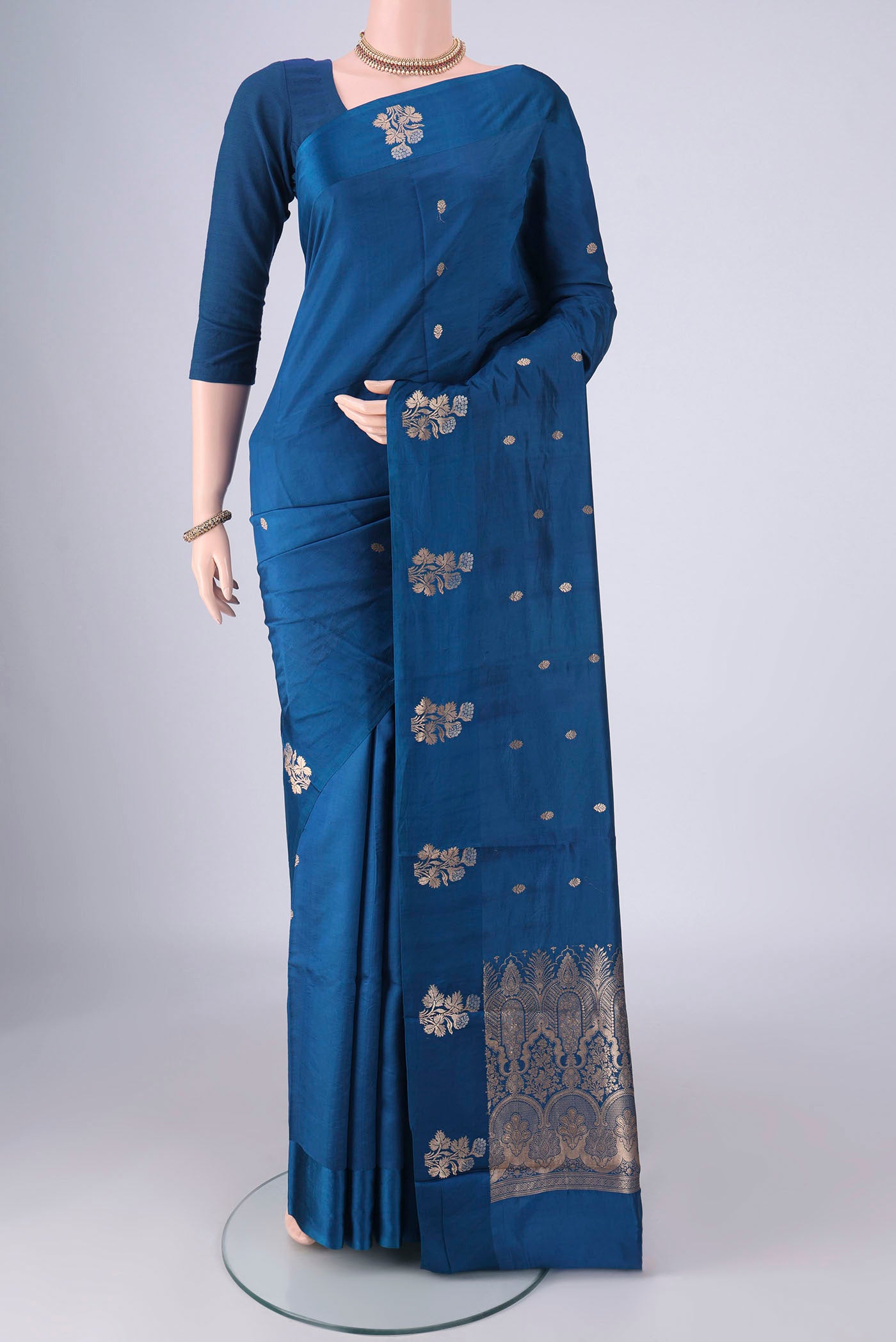Royal Blue Banarasi Katan Silk Saree with Zari Butta on the body and Satin Border.  displayed on a mannequin
