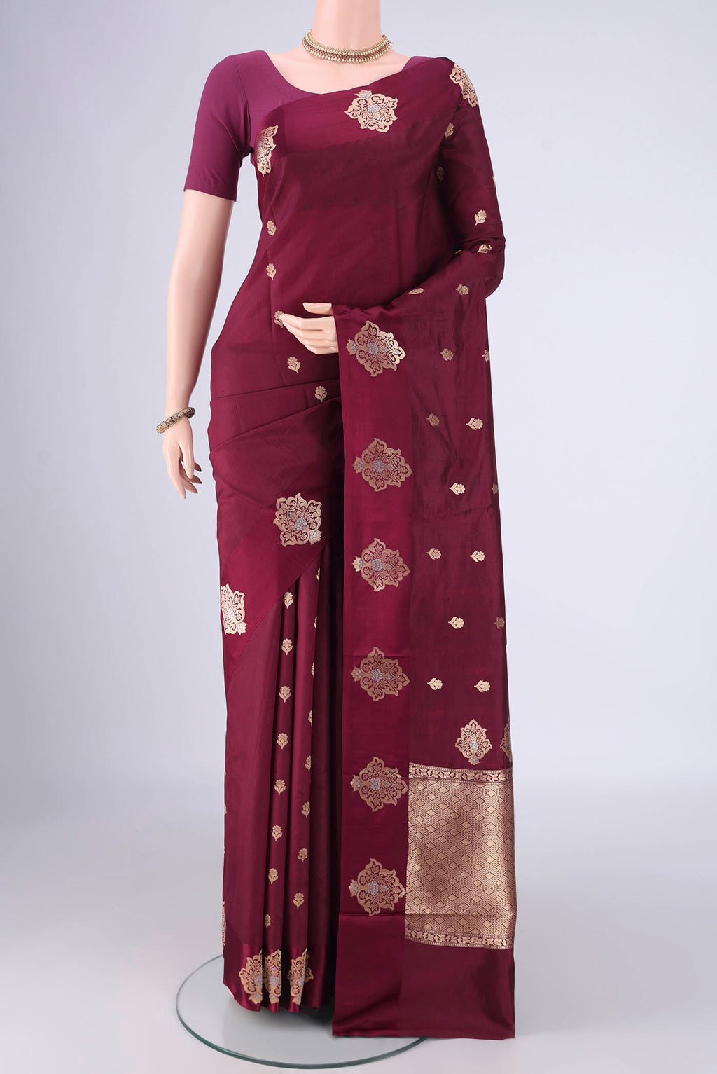 Coffee Brown Banarasi Katan Silk Saree with Zari Butta on the body and Satin Border.  displayed on a mannequin